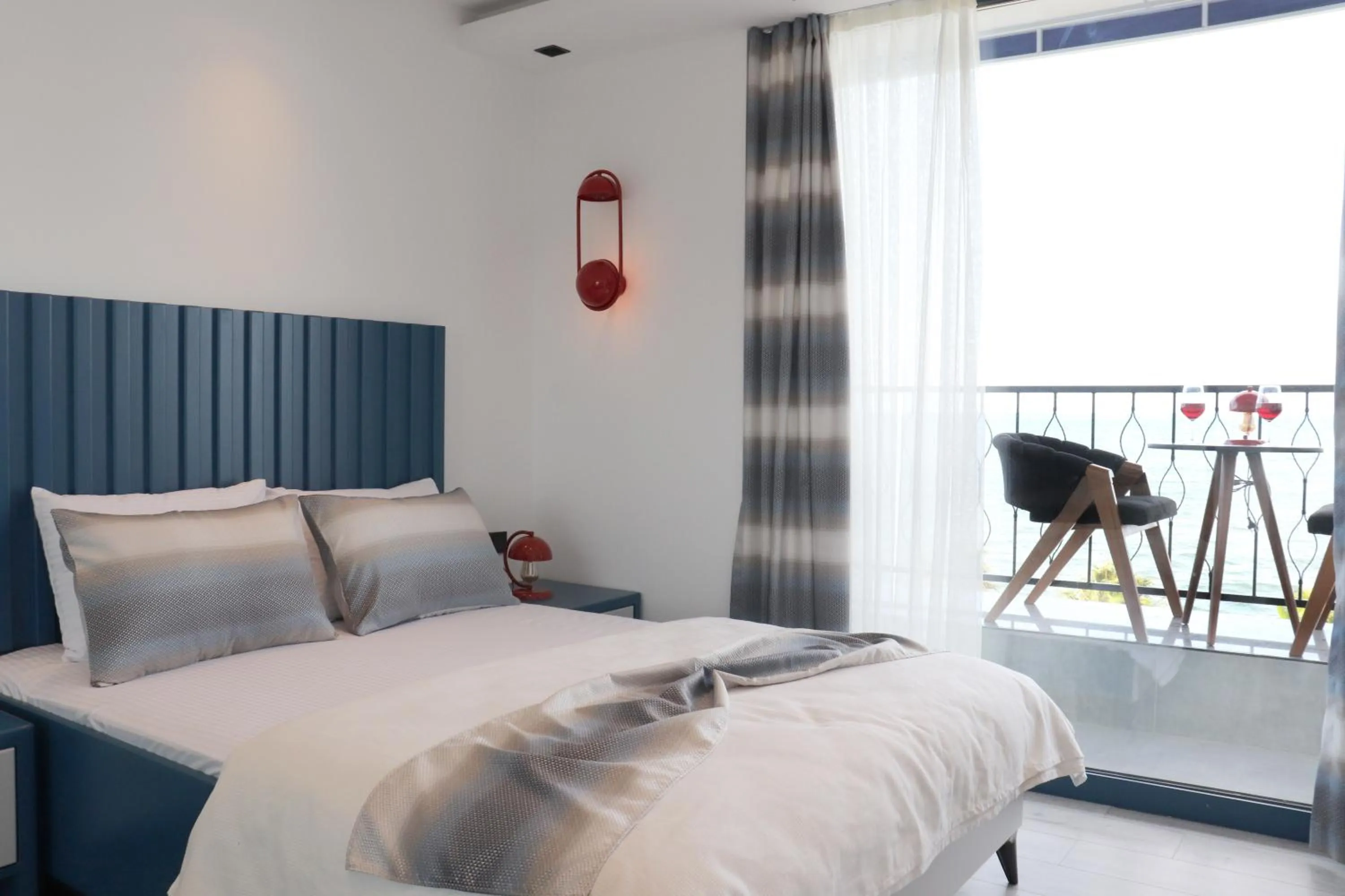 Bed in Blue Ay Boutique Hotel