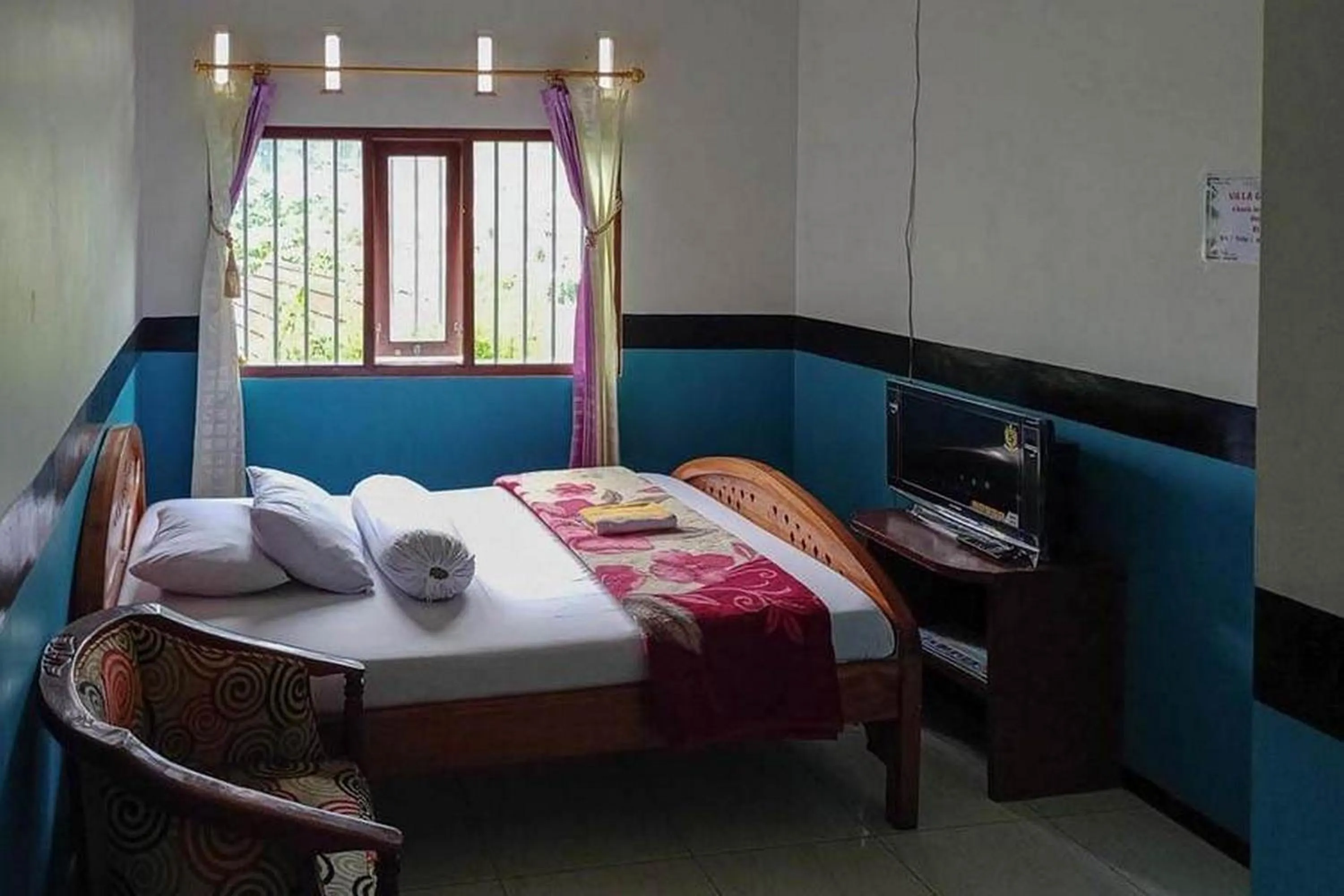 Bed in Villa Ghazani 4 at Desa Wisata Songgokerto