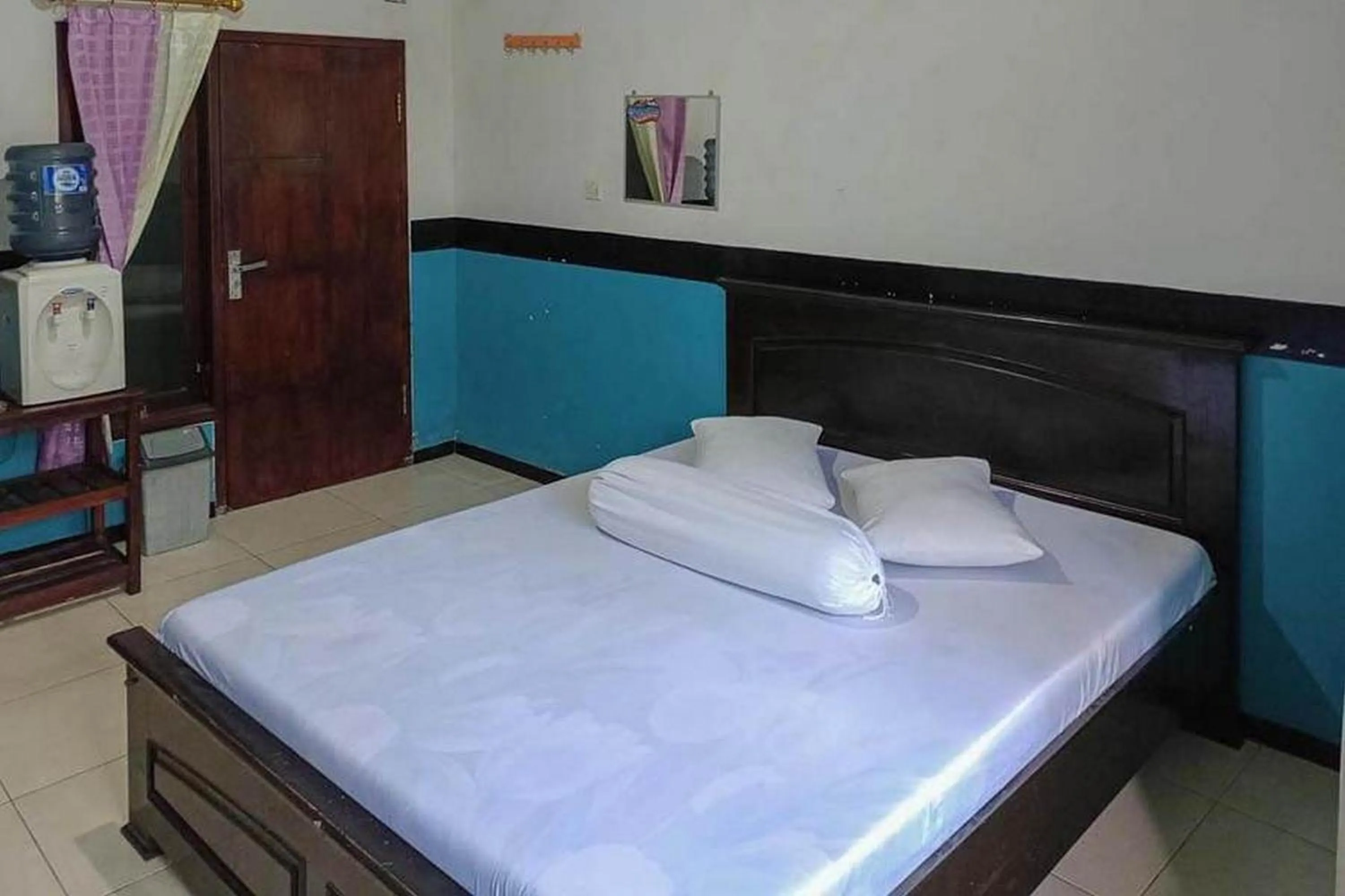 Bed in Villa Ghazani 4 at Desa Wisata Songgokerto