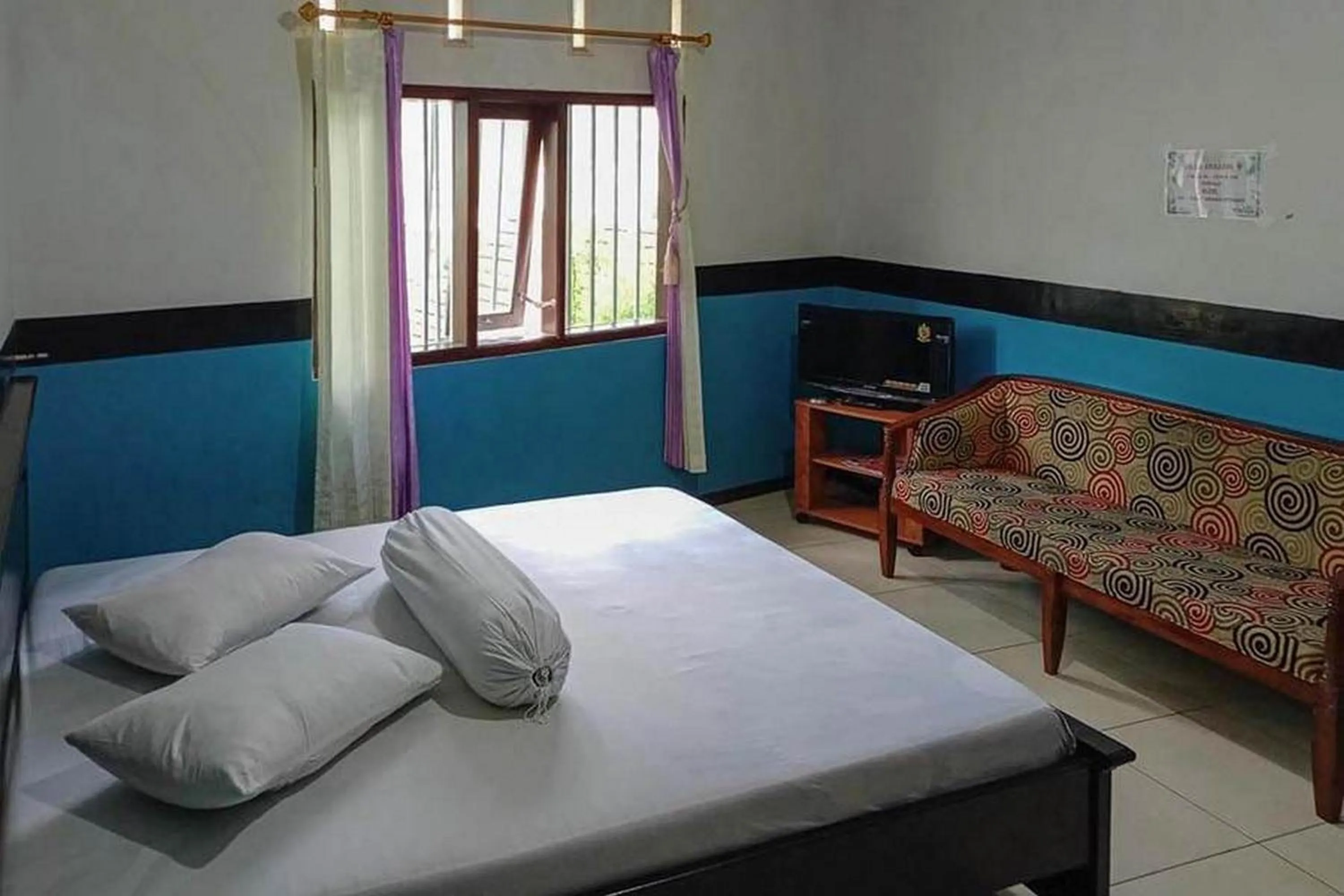 Bed in Villa Ghazani 4 at Desa Wisata Songgokerto