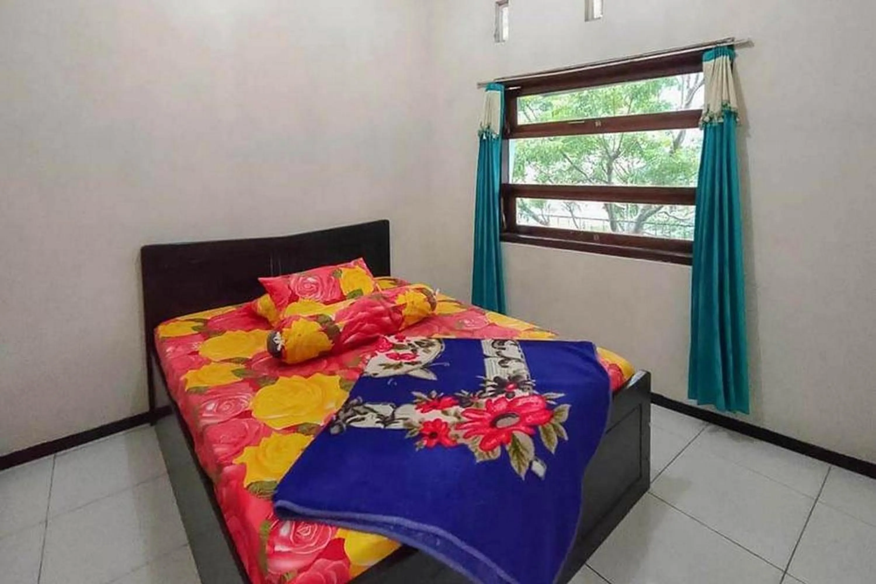 Bed in Villa Ghazani 4 at Desa Wisata Songgokerto