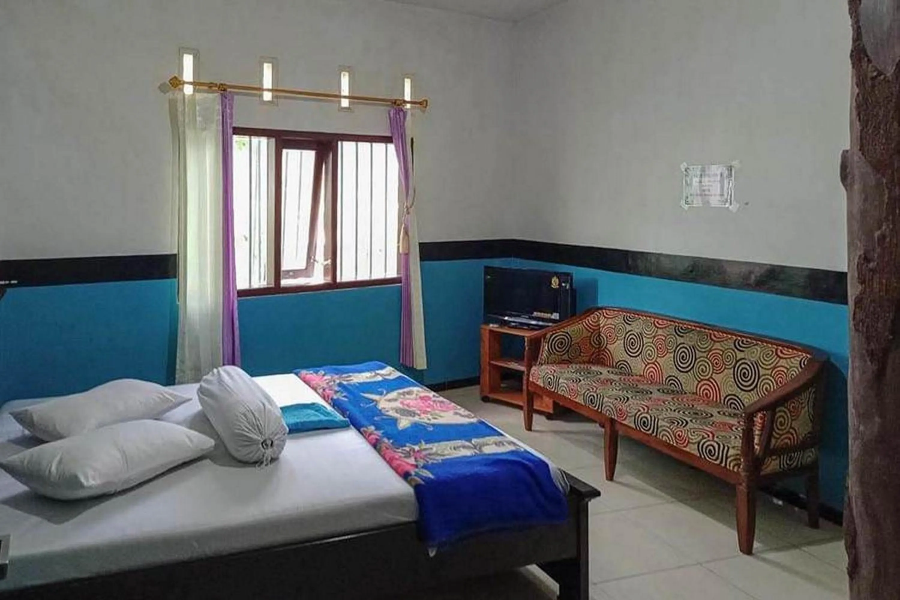 Bed in Villa Ghazani 4 at Desa Wisata Songgokerto