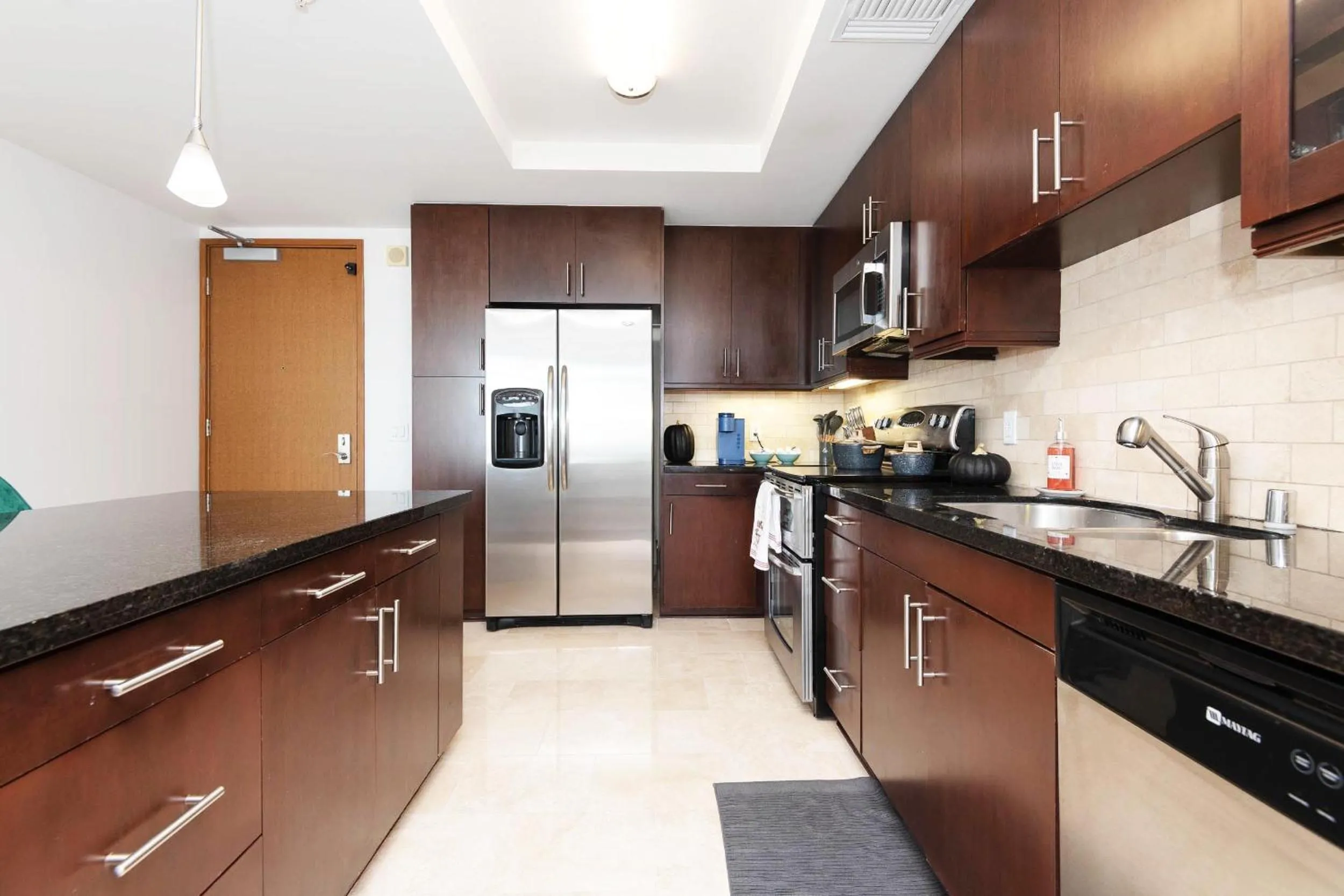 Kitchen or kitchenette in Sky-Rise Apartments