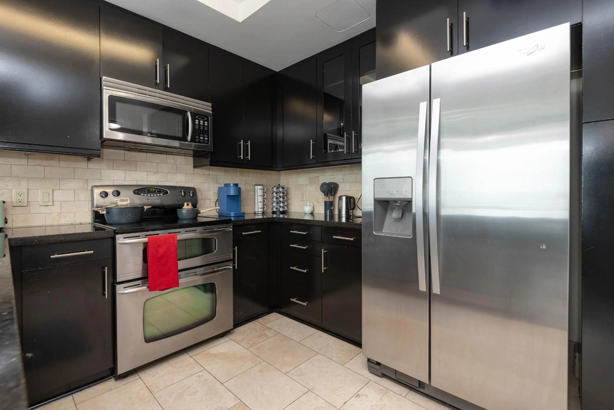 Kitchen or kitchenette in Sky-Rise Apartments