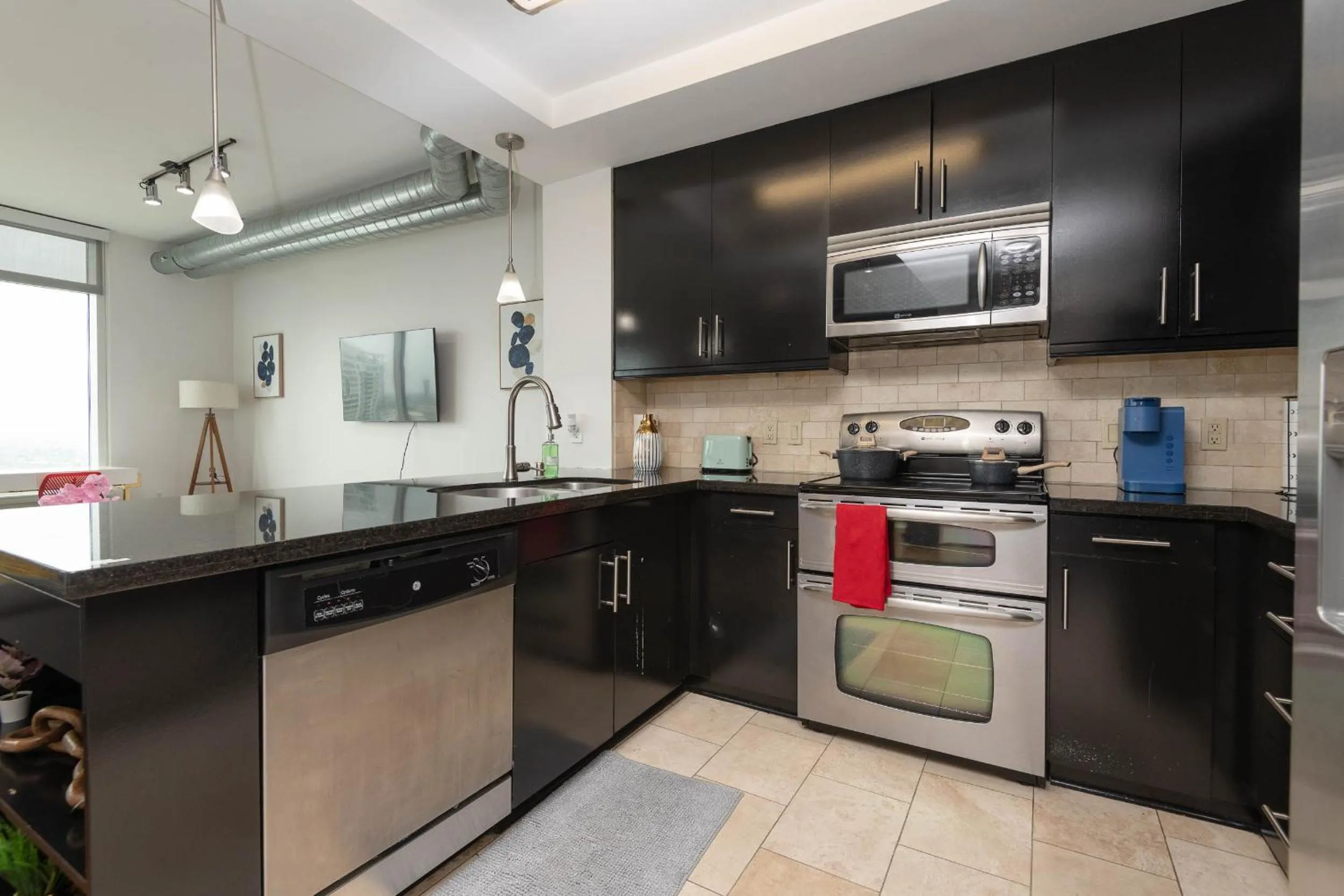 Kitchen or kitchenette in Sky-Rise Apartments