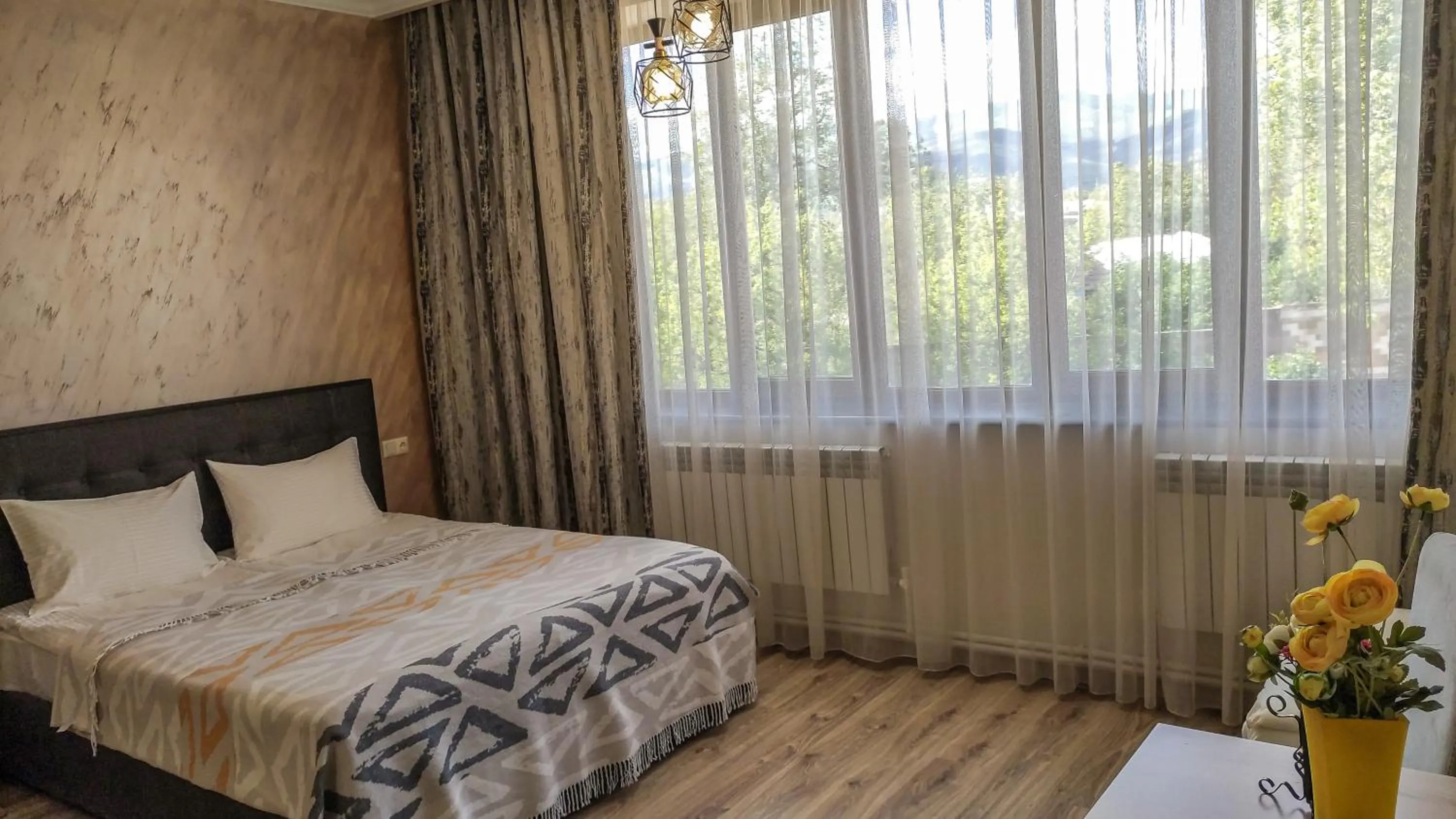 Bed in Harmonia Garden GastroYard&Hotel