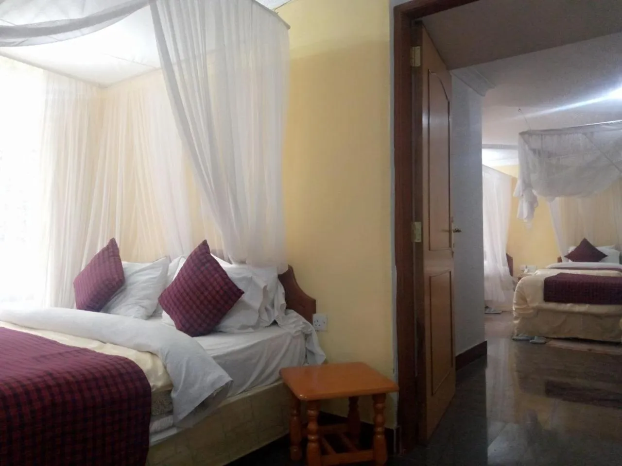 Bed in Karibu Heritage House