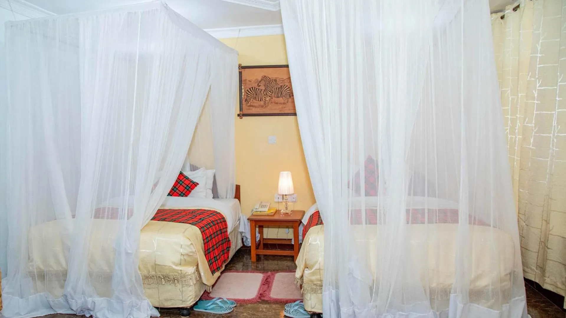 Bed in Karibu Heritage House