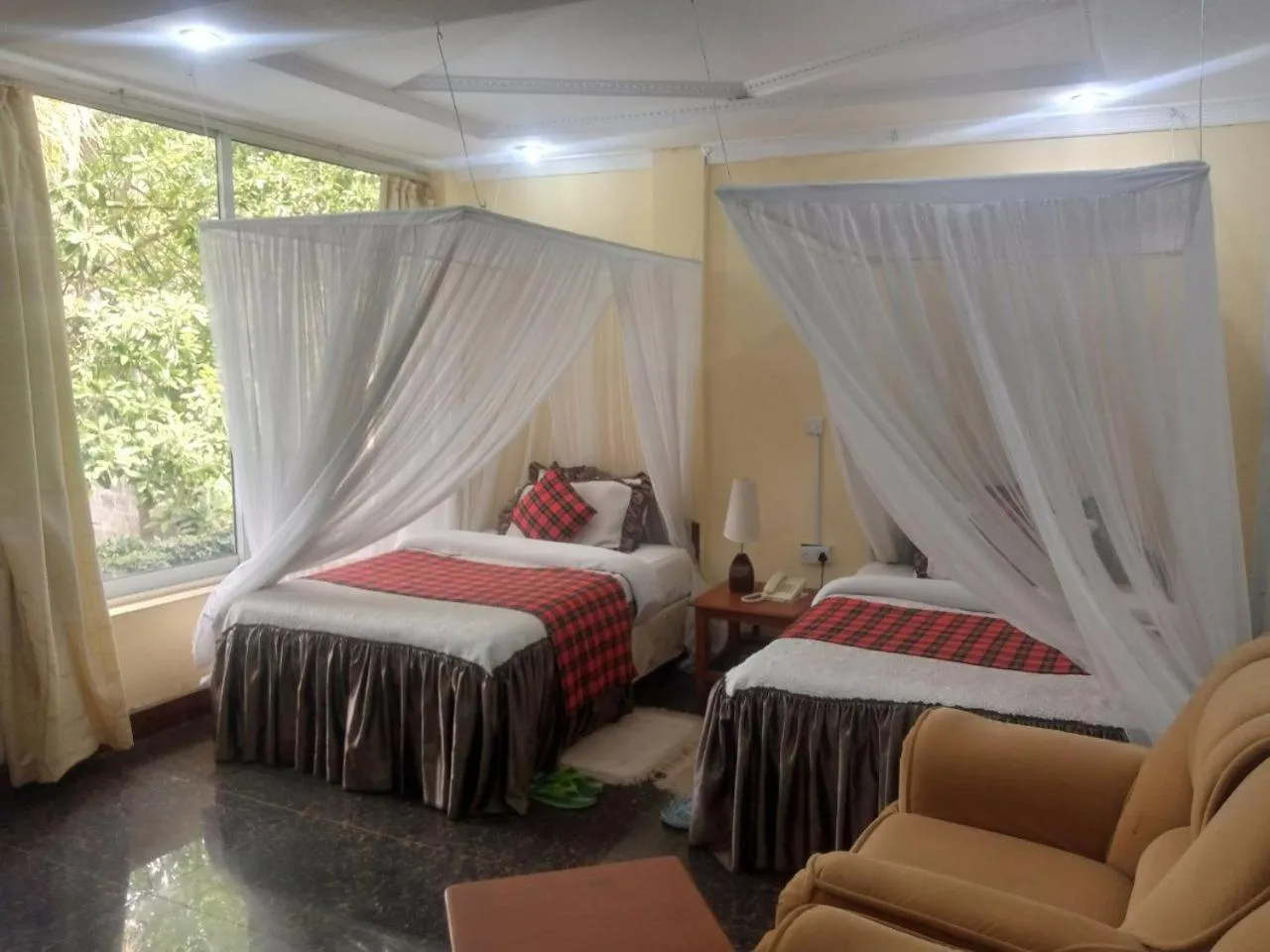 Bed in Karibu Heritage House