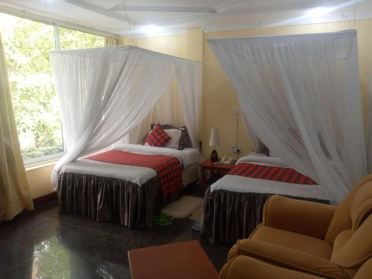 Bed in Karibu Heritage House