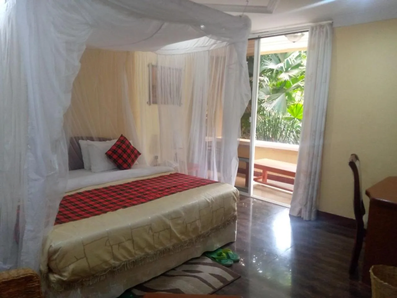 Bed in Karibu Heritage House