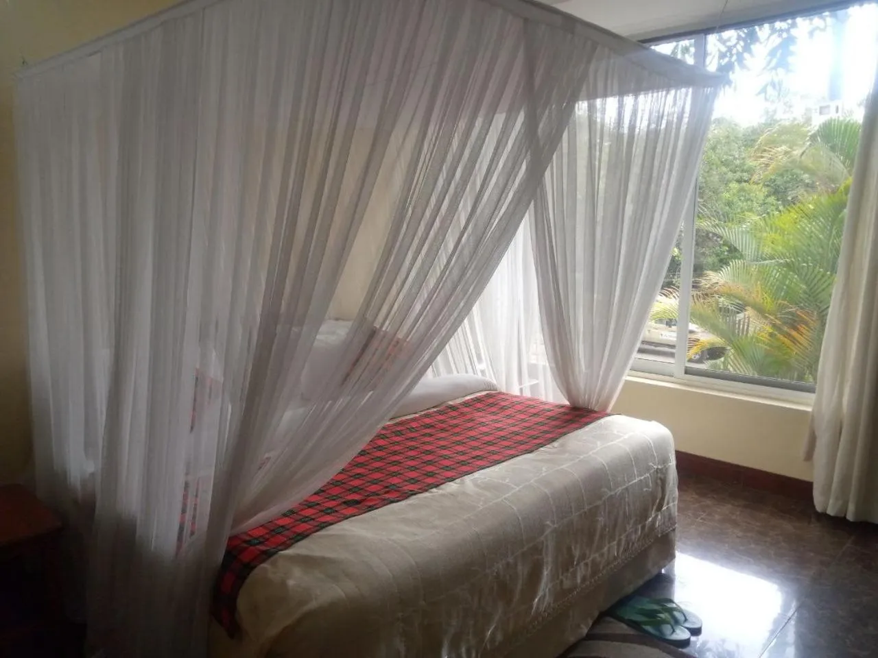 Bed in Karibu Heritage House