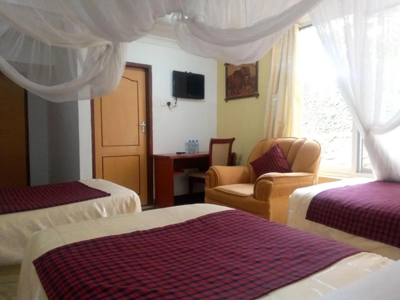 Bed in Karibu Heritage House