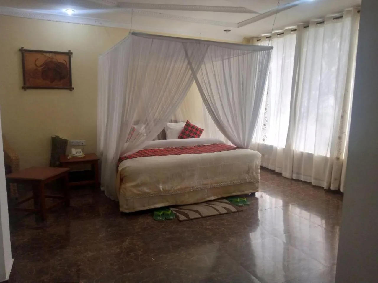 Bed in Karibu Heritage House