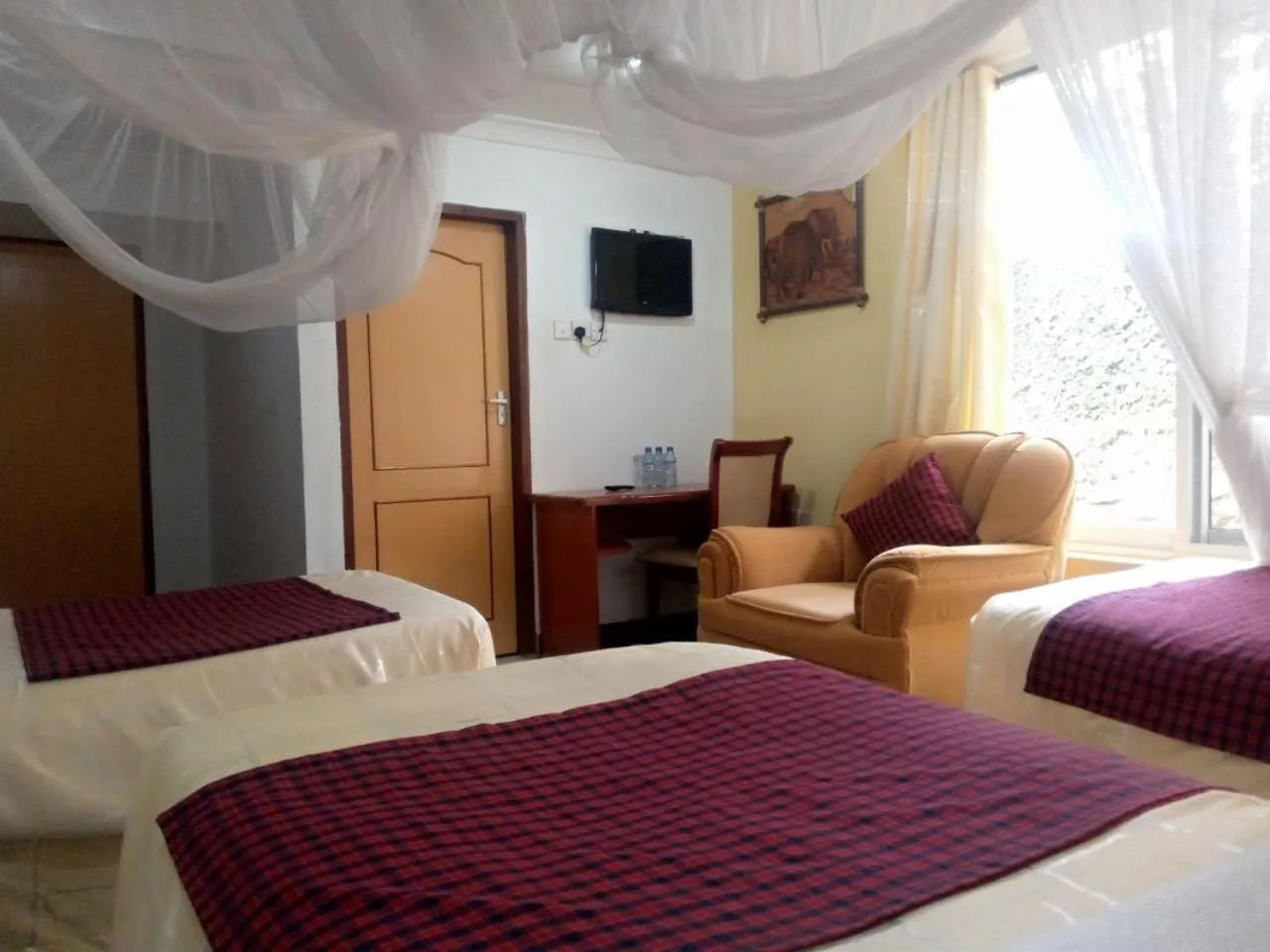 Bed in Karibu Heritage House