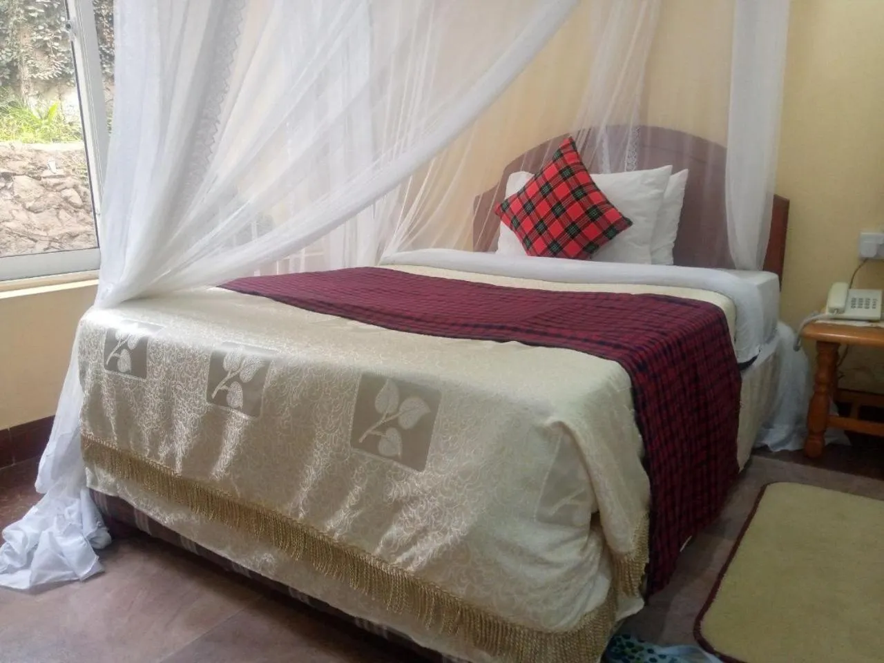 Bed in Karibu Heritage House