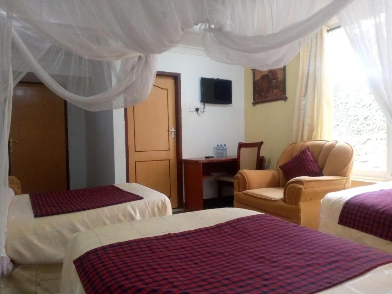 Bed in Karibu Heritage House