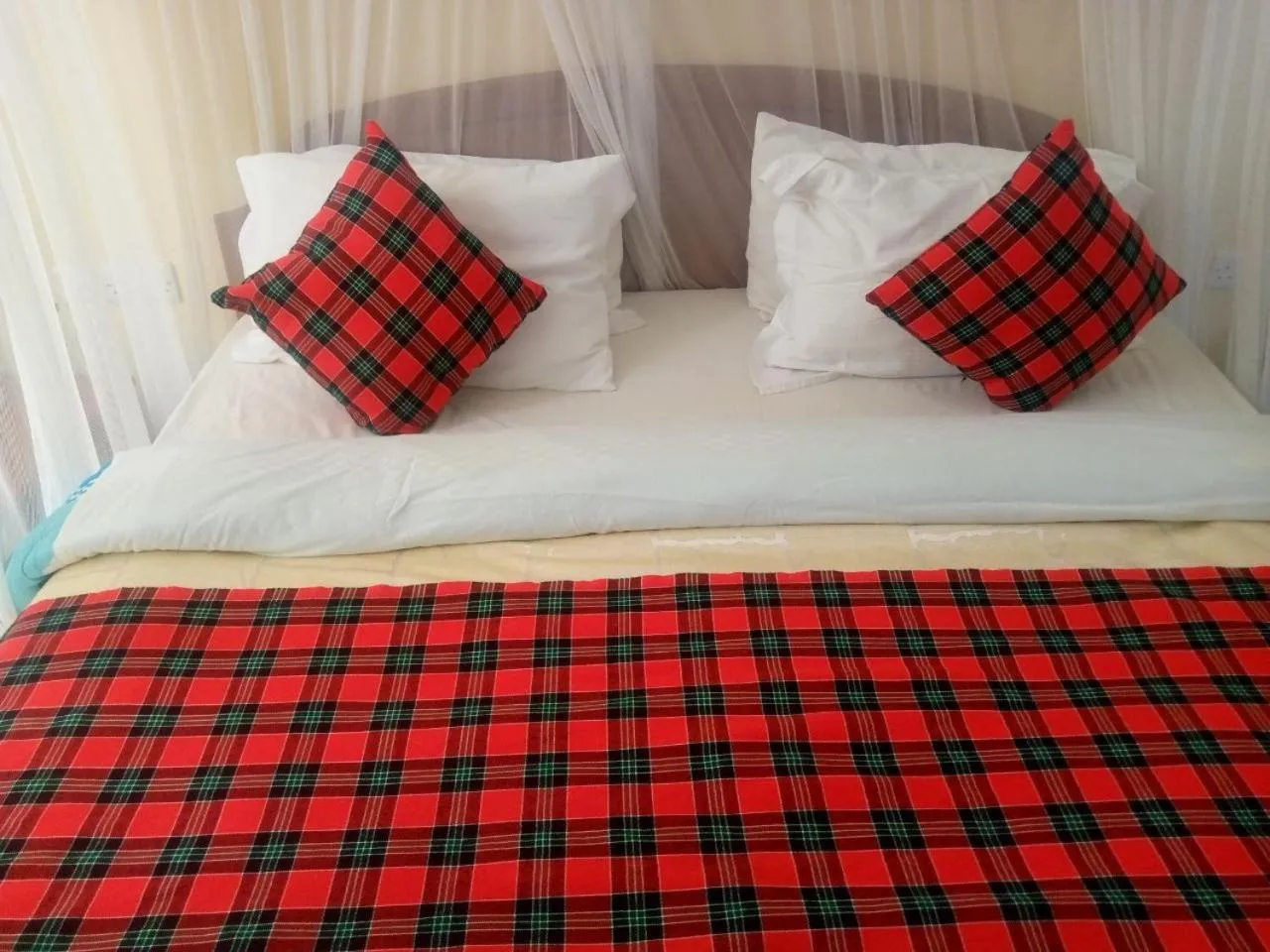 Bed in Karibu Heritage House