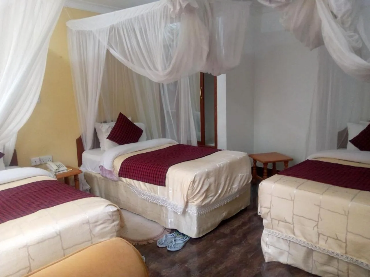 Bed in Karibu Heritage House