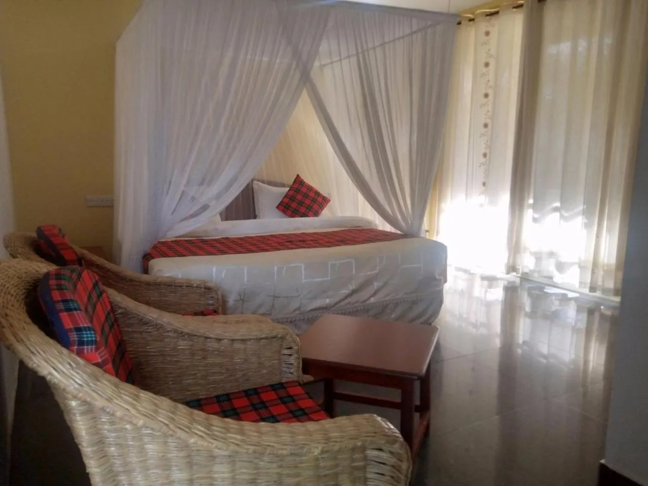 Bed in Karibu Heritage House