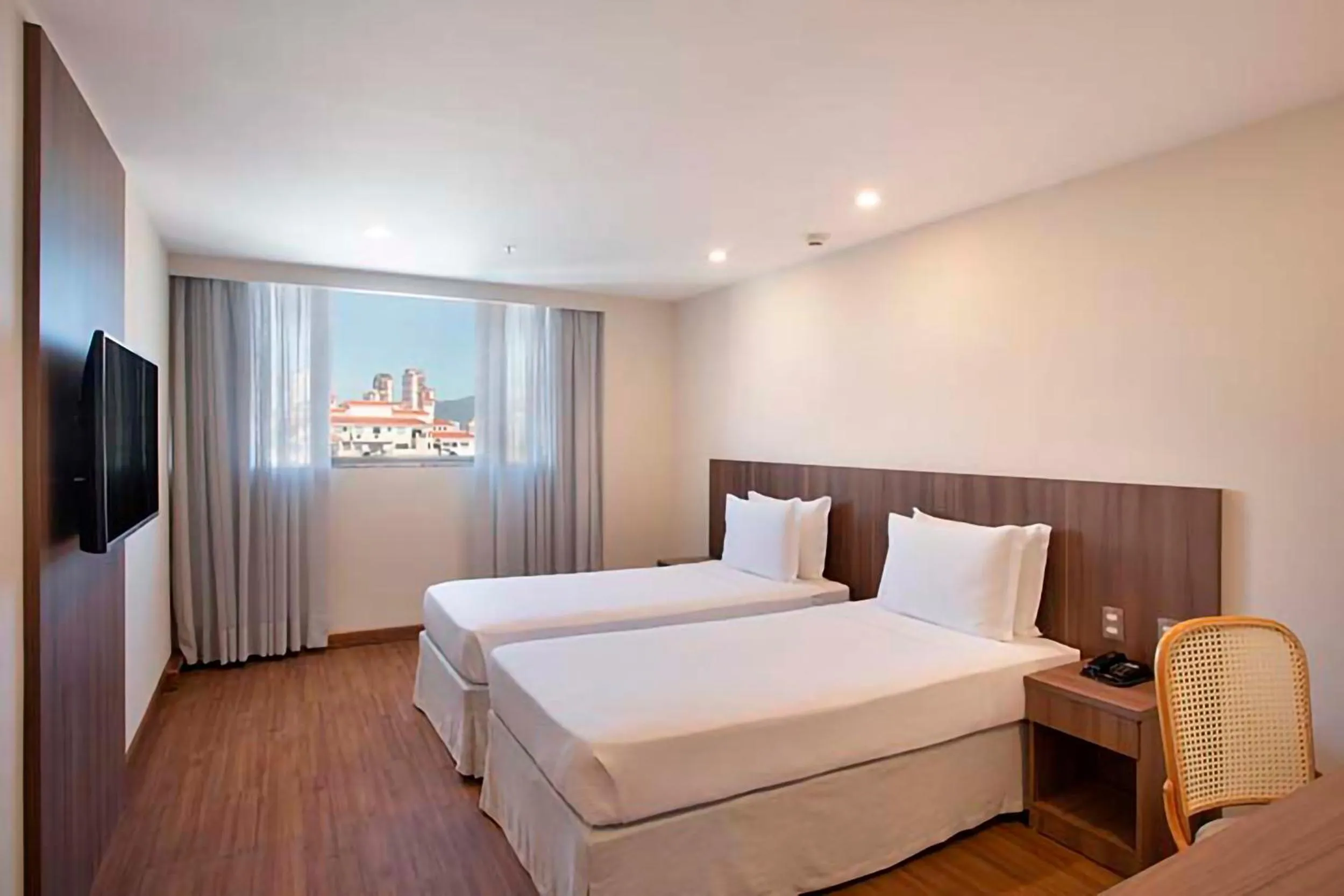 Bed in Windsor Tower Hotel