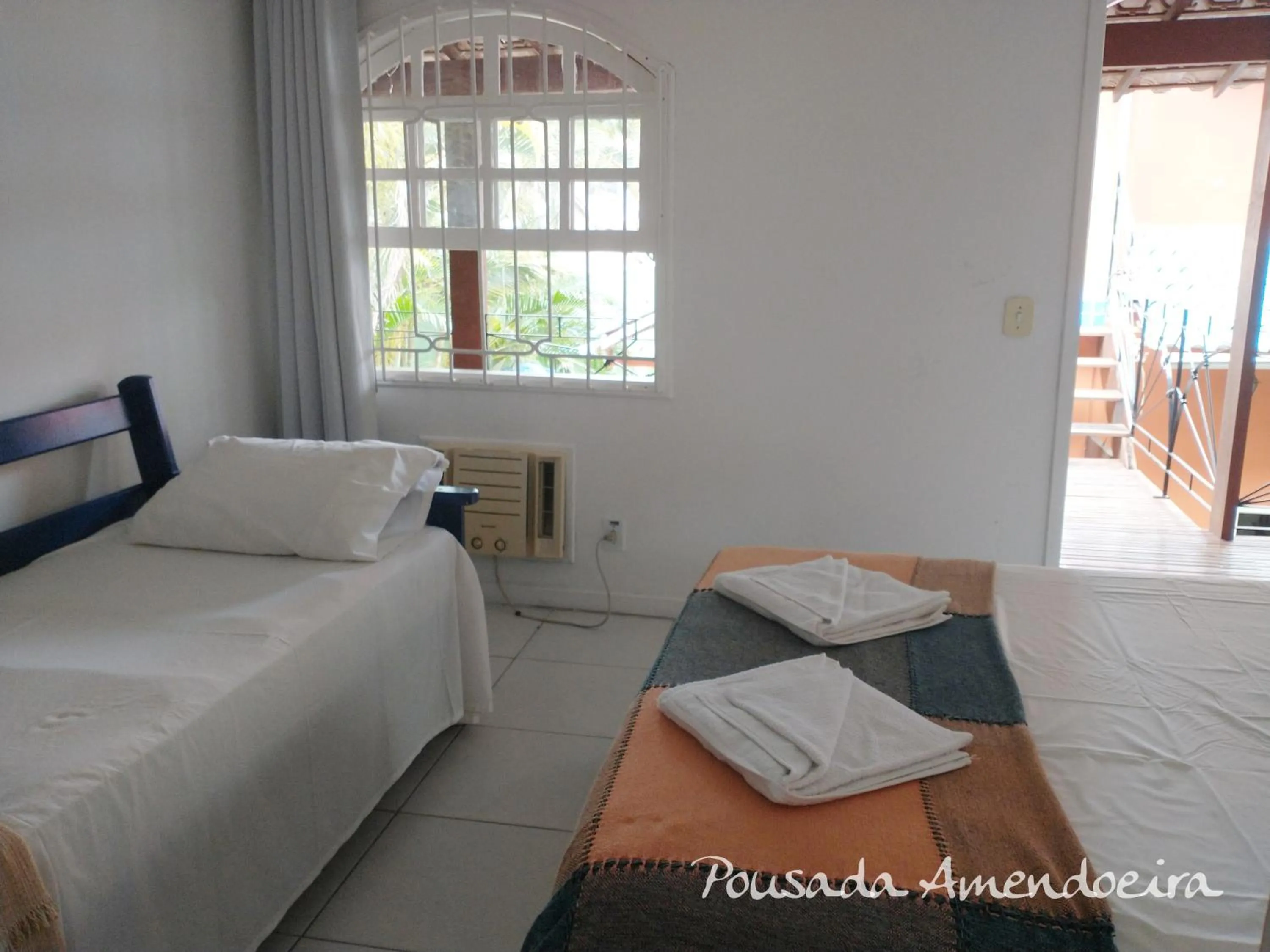 Bed in POUSADA AMENDOEIRA