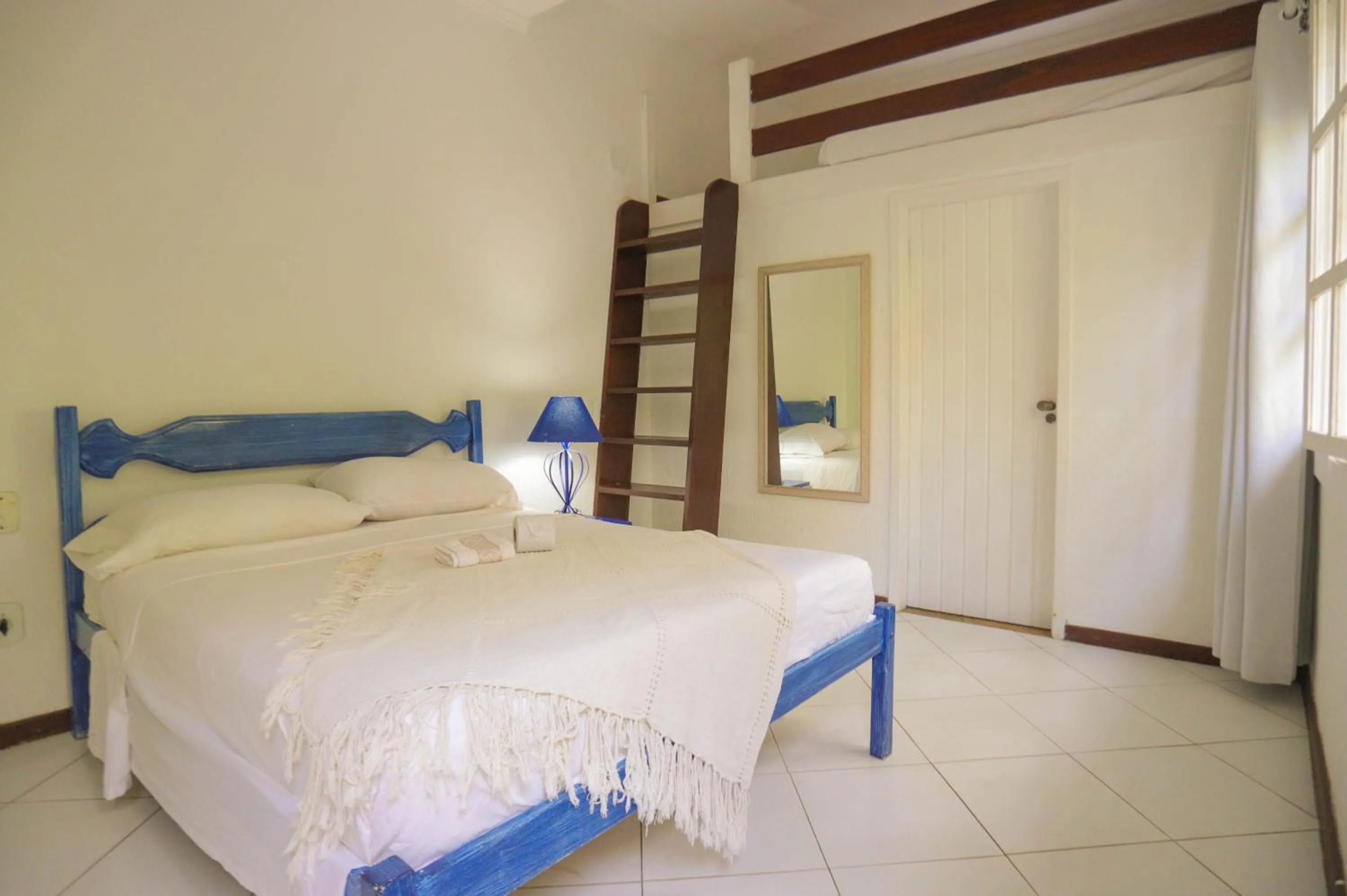 Bed in POUSADA AMENDOEIRA