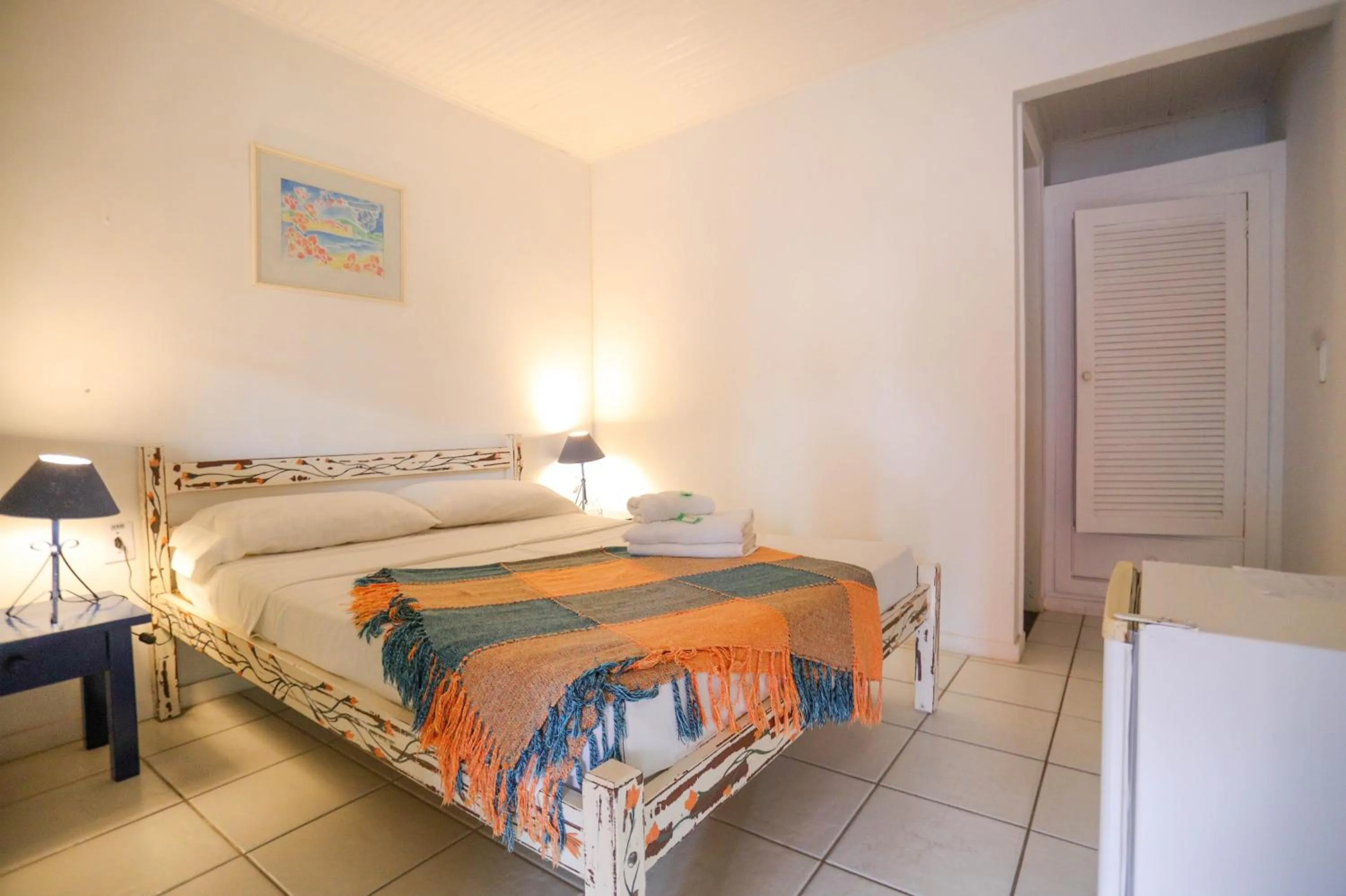 Photo of the whole room, Bed in POUSADA AMENDOEIRA