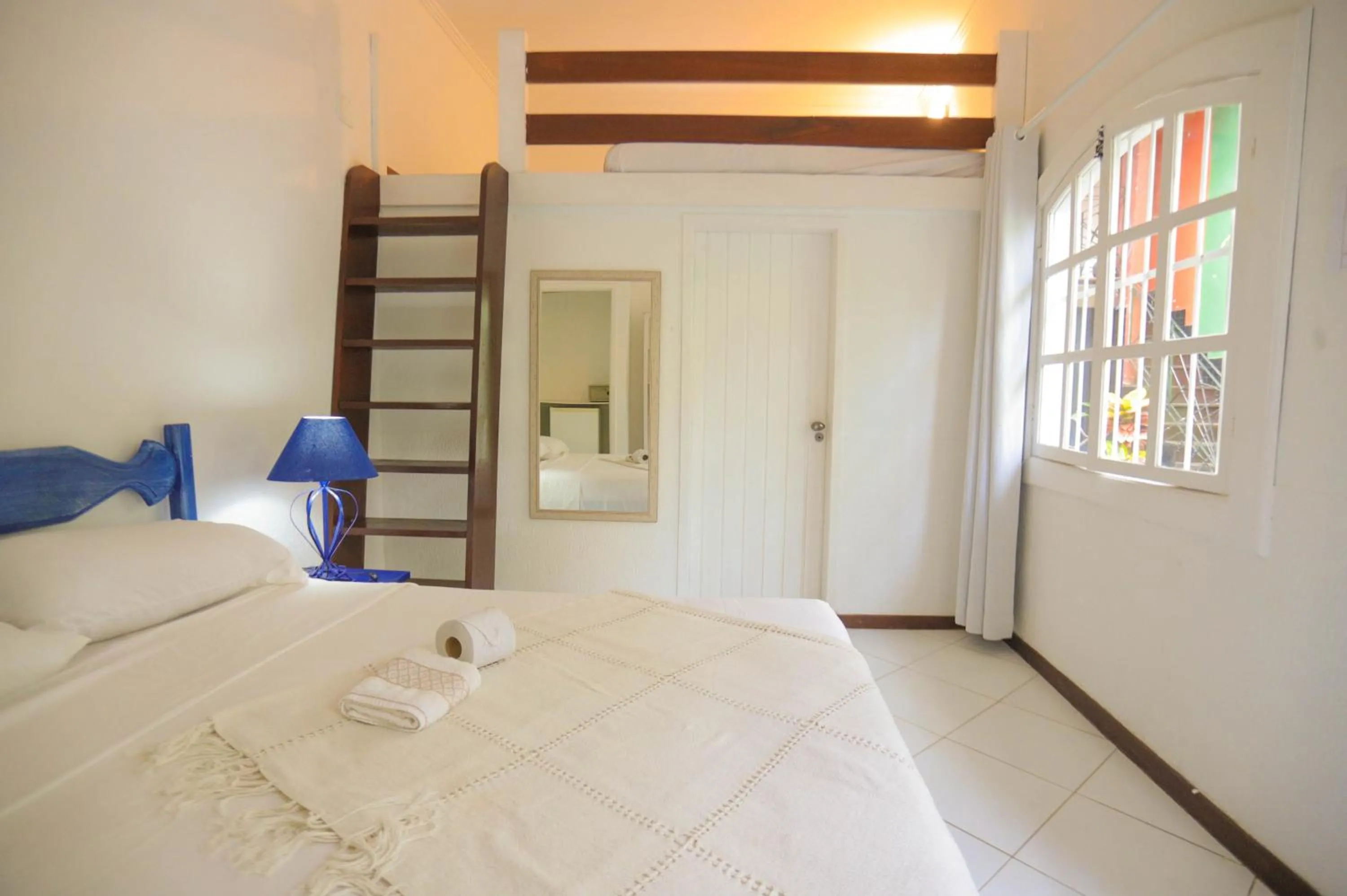 Bed in POUSADA AMENDOEIRA