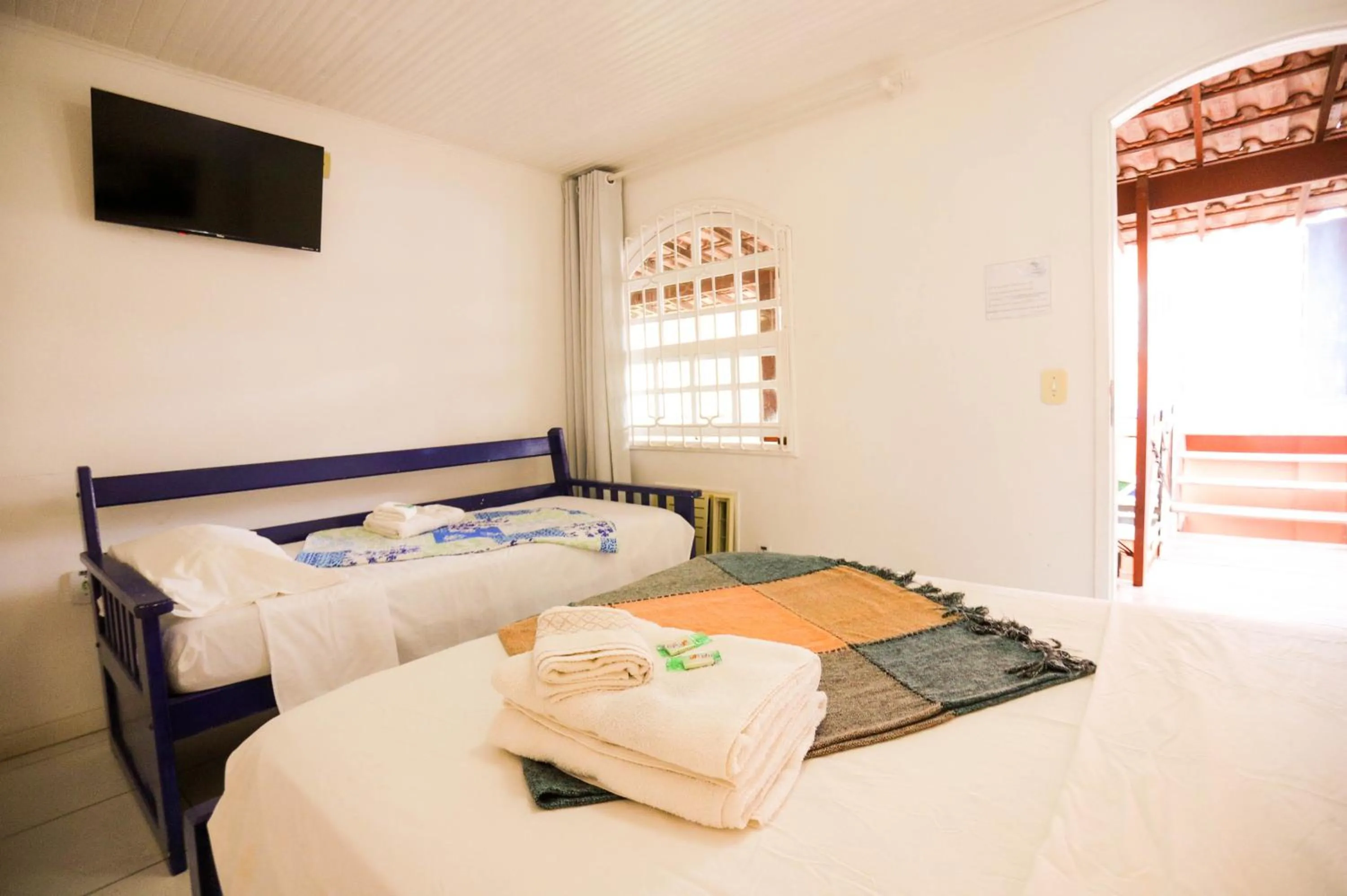 Bed in POUSADA AMENDOEIRA