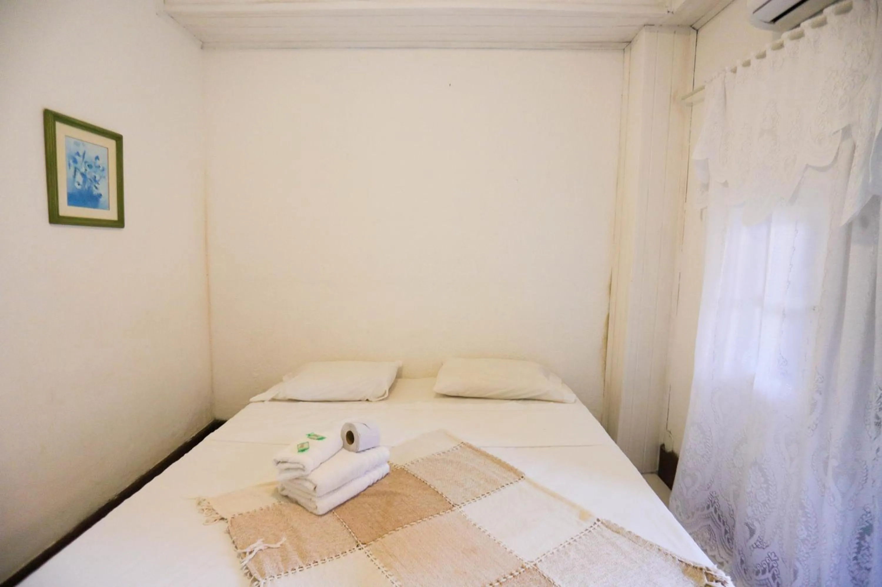 Bed in POUSADA AMENDOEIRA