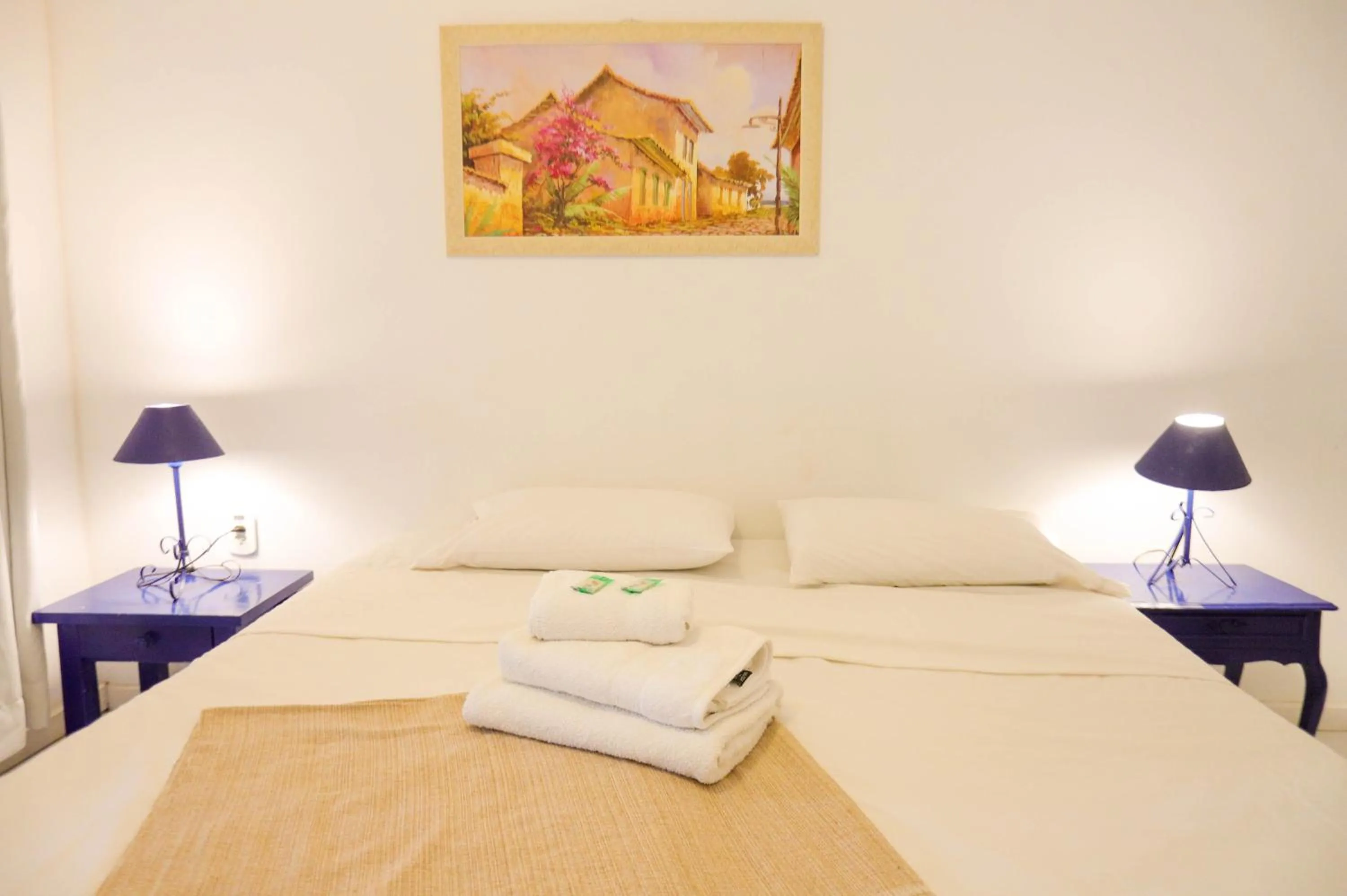 Bed in POUSADA AMENDOEIRA