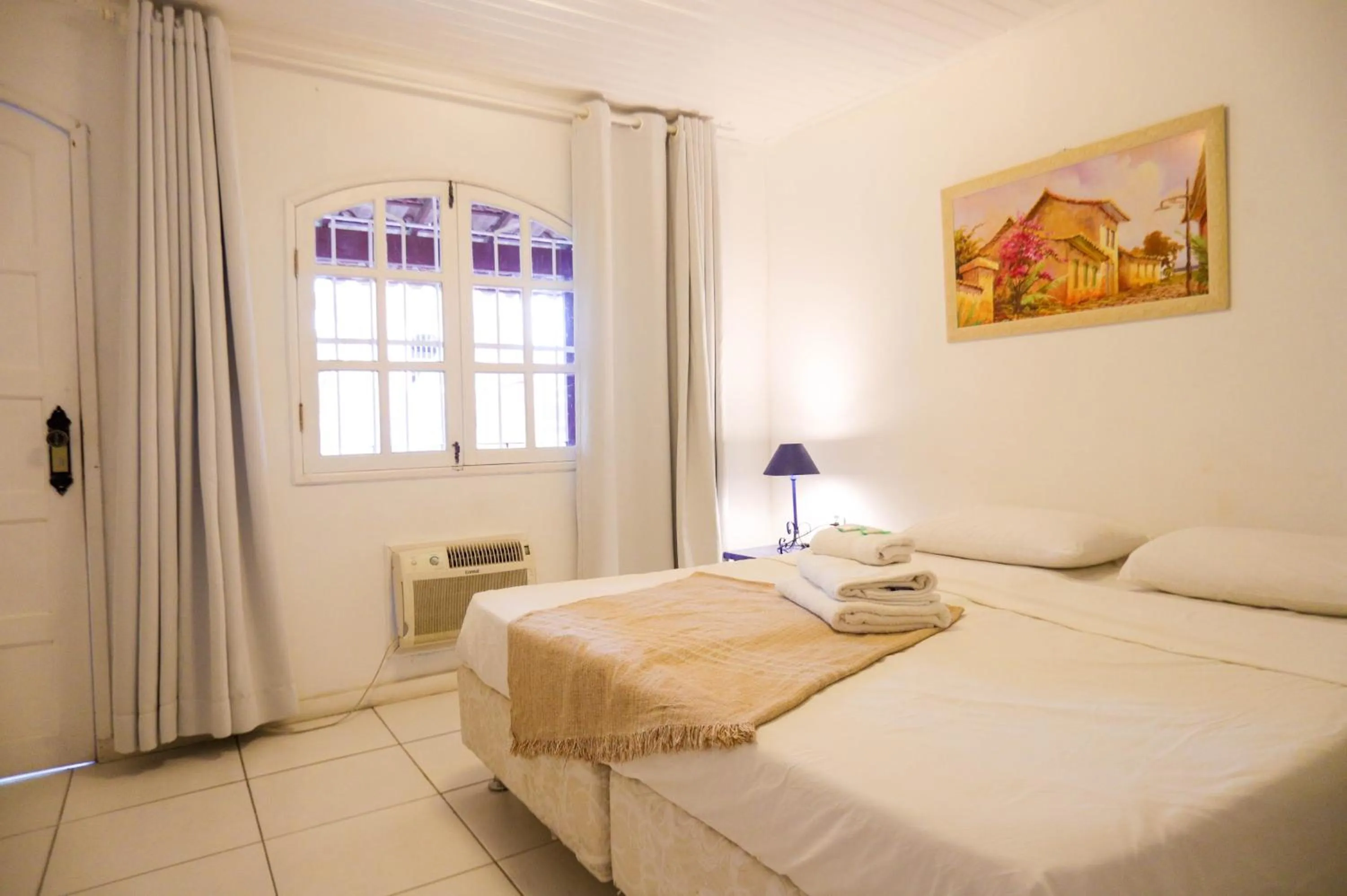 Bed in POUSADA AMENDOEIRA