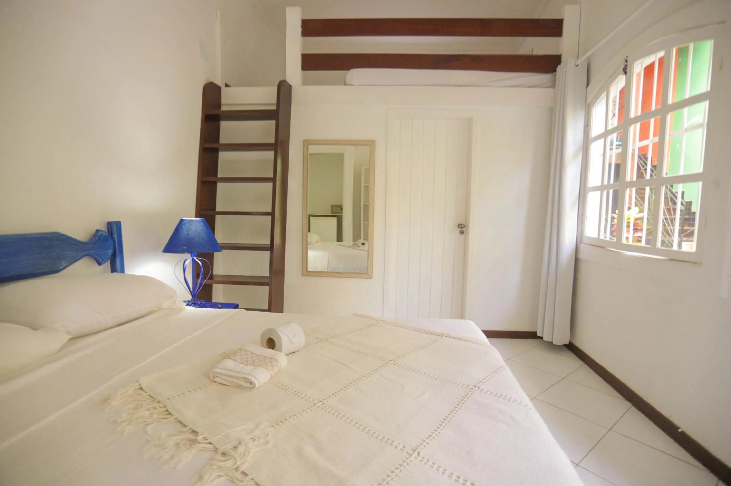 Bed in POUSADA AMENDOEIRA