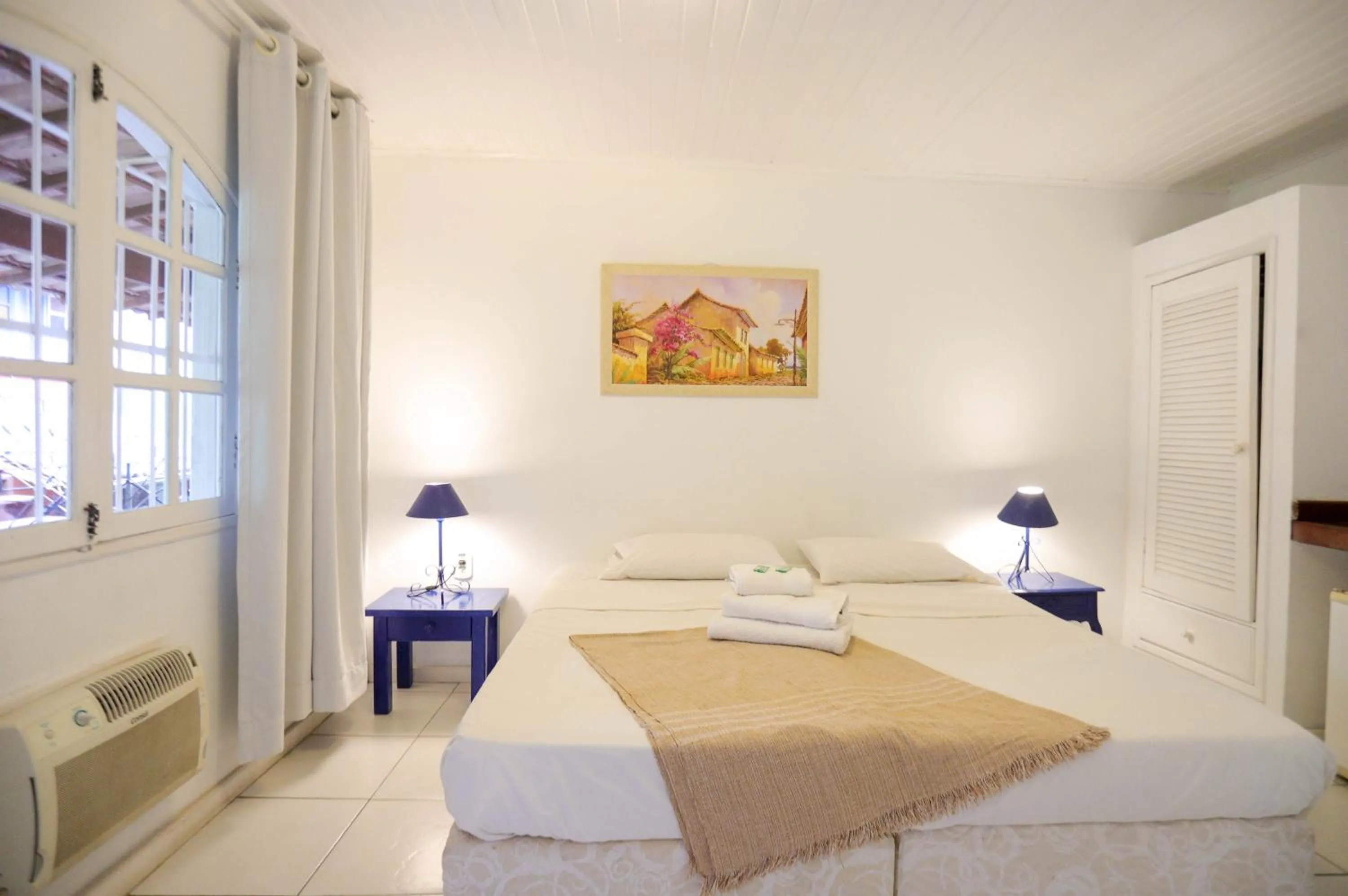 Bed in POUSADA AMENDOEIRA