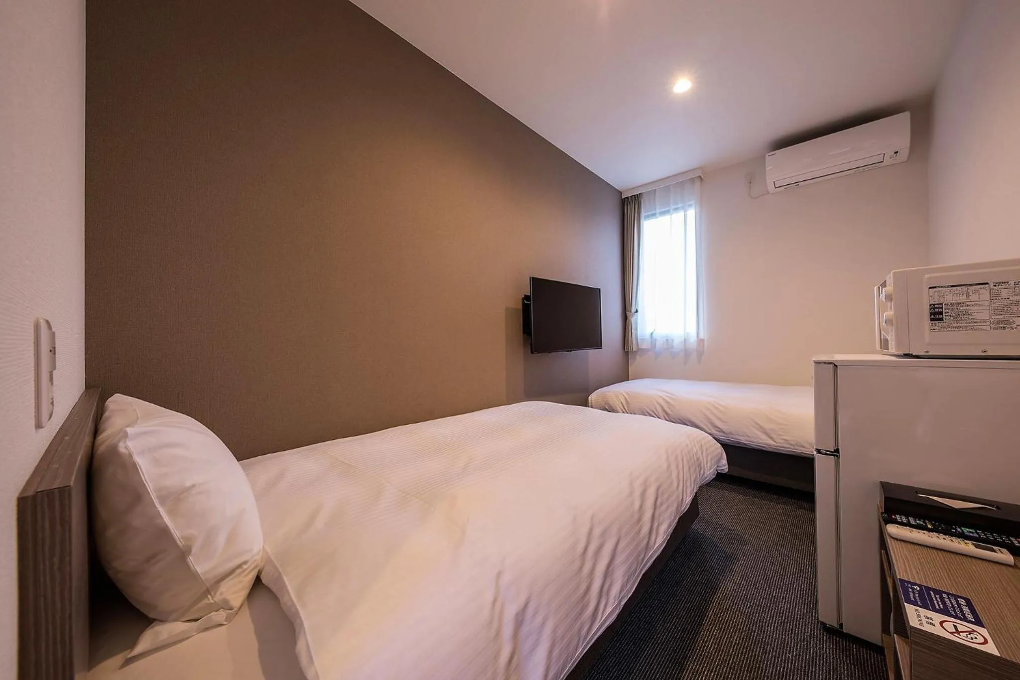 Photo of the whole room, Bed in HOTEL R9 The Yard Uruma