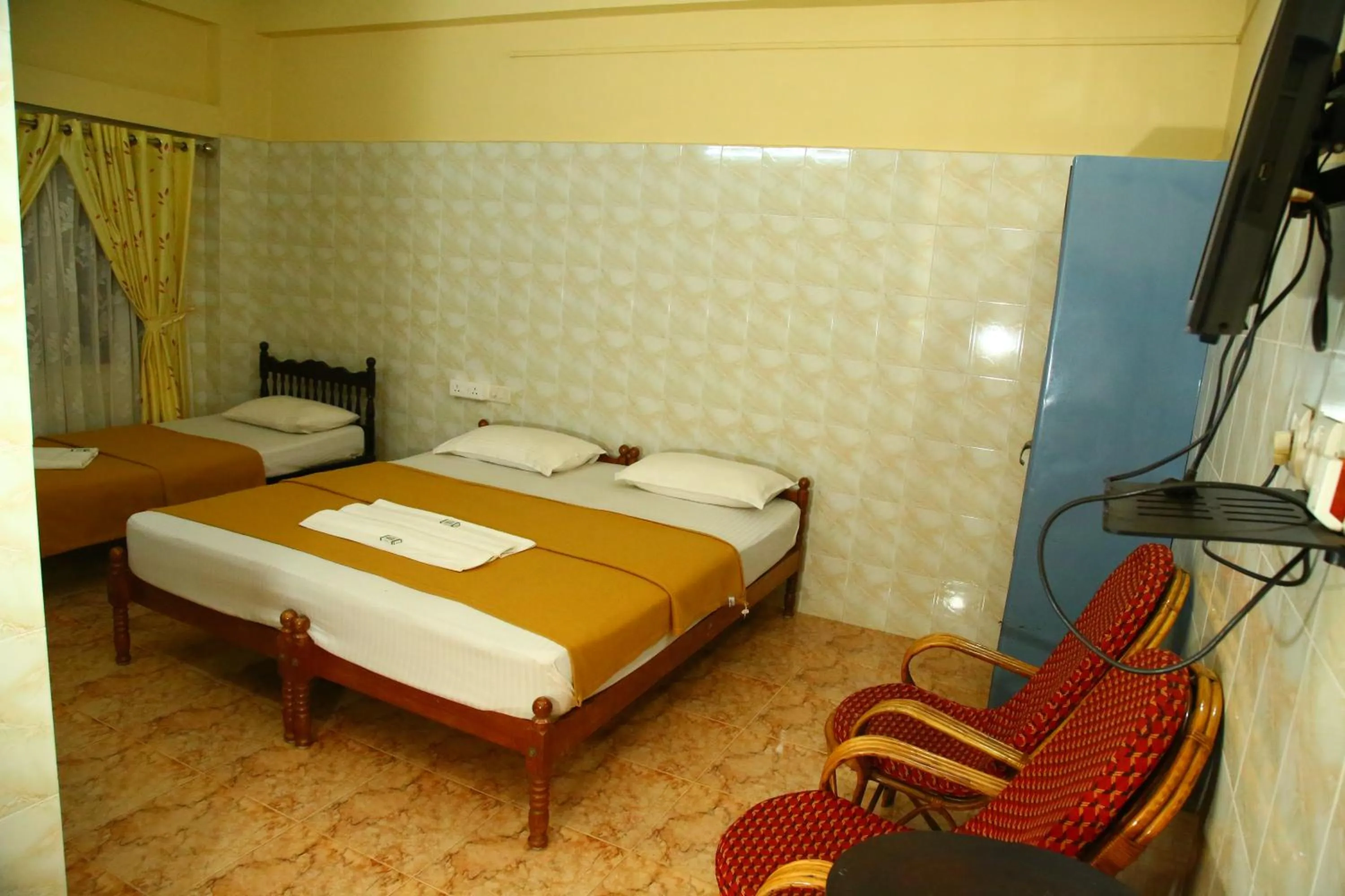 Bed in Lake Palace Family Resort Kumarakom