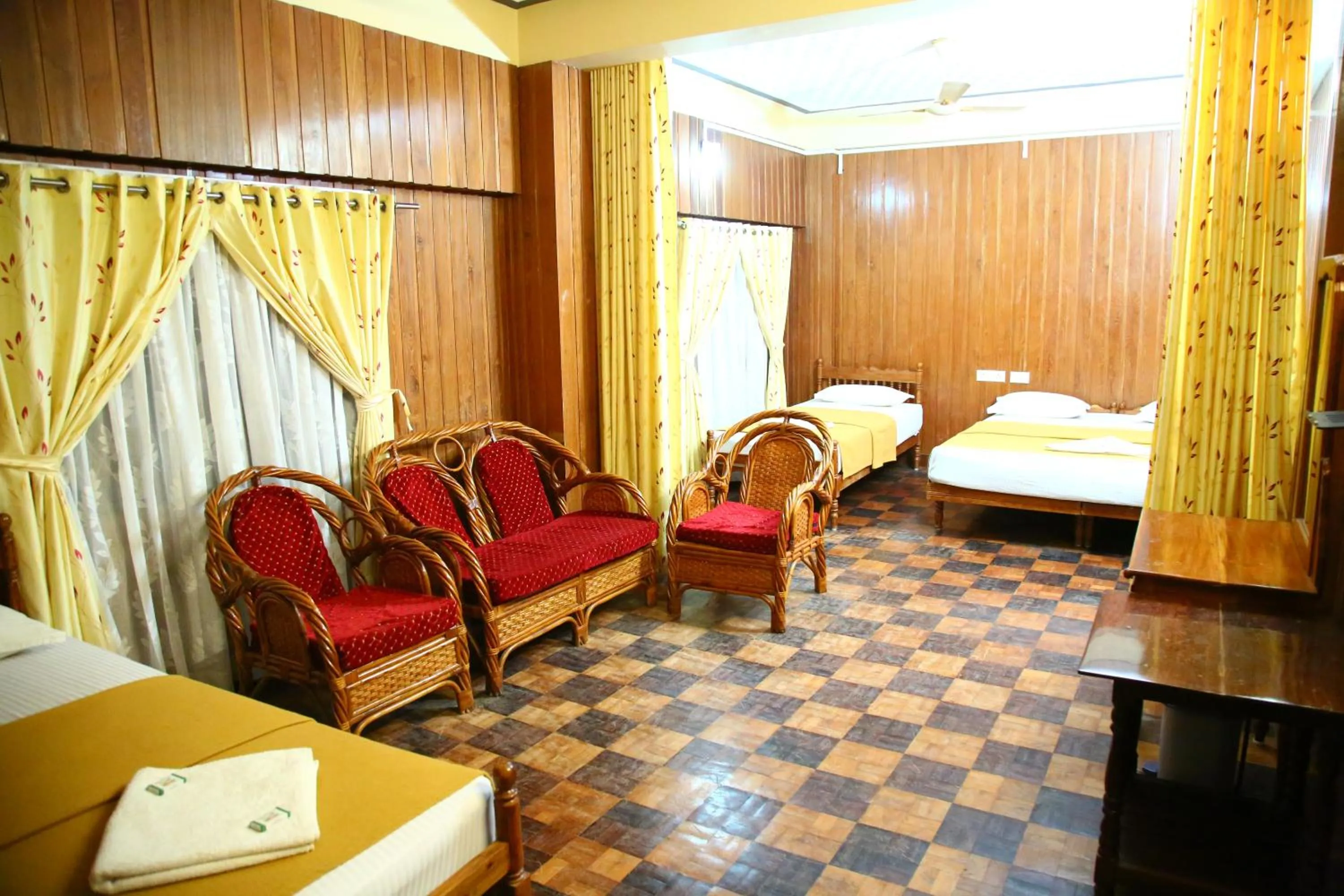 Bed in Lake Palace Family Resort Kumarakom