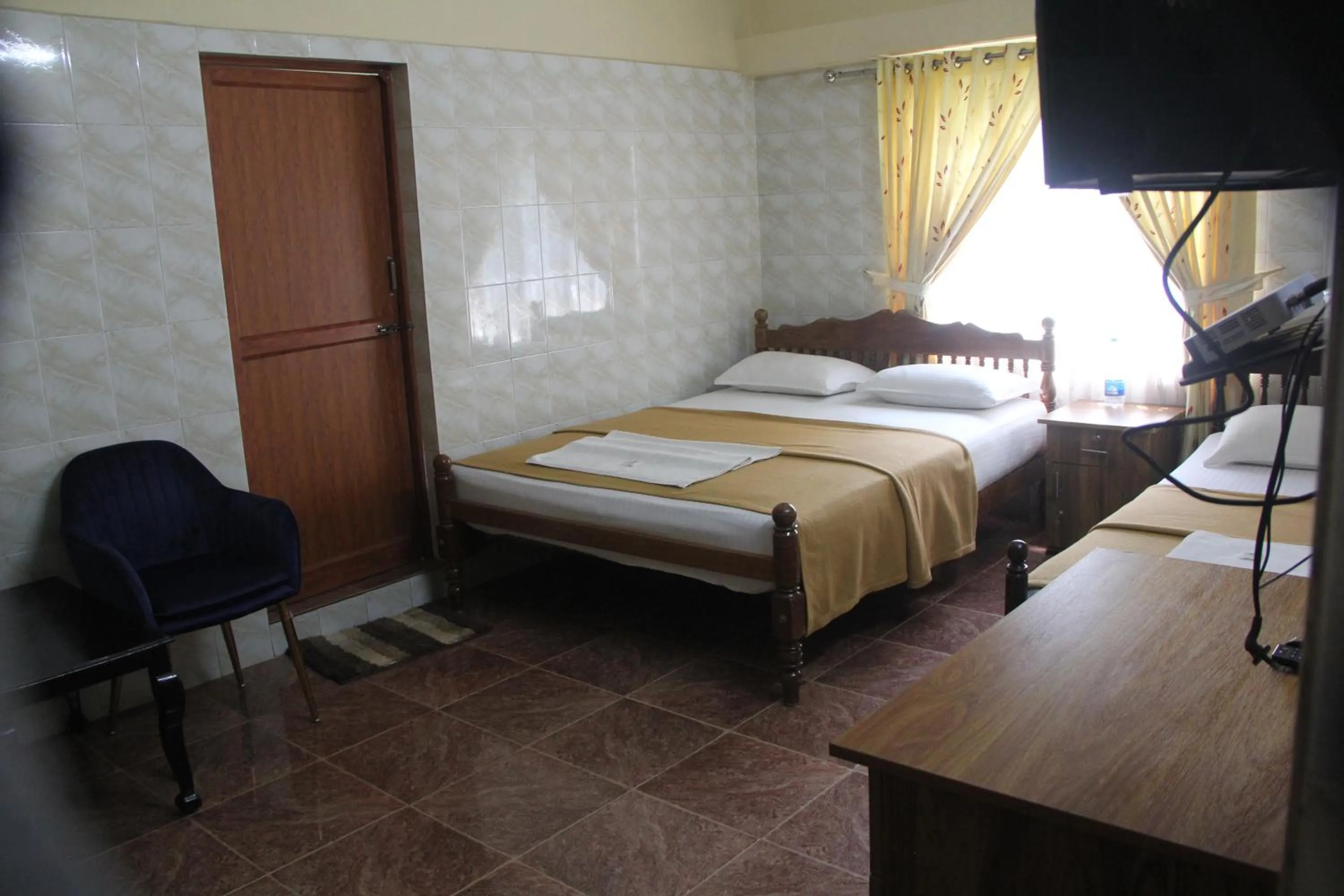 Bed in Lake Palace Family Resort Kumarakom