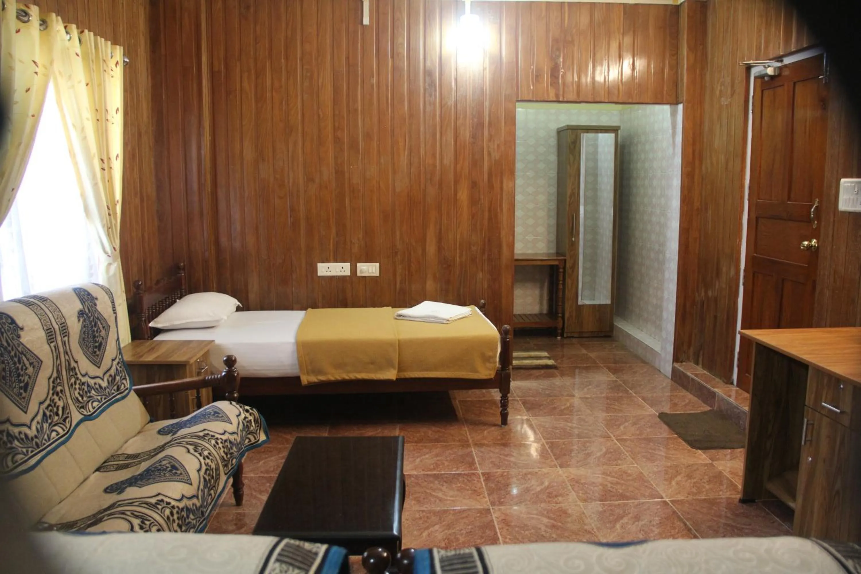 Bed in Lake Palace Family Resort Kumarakom