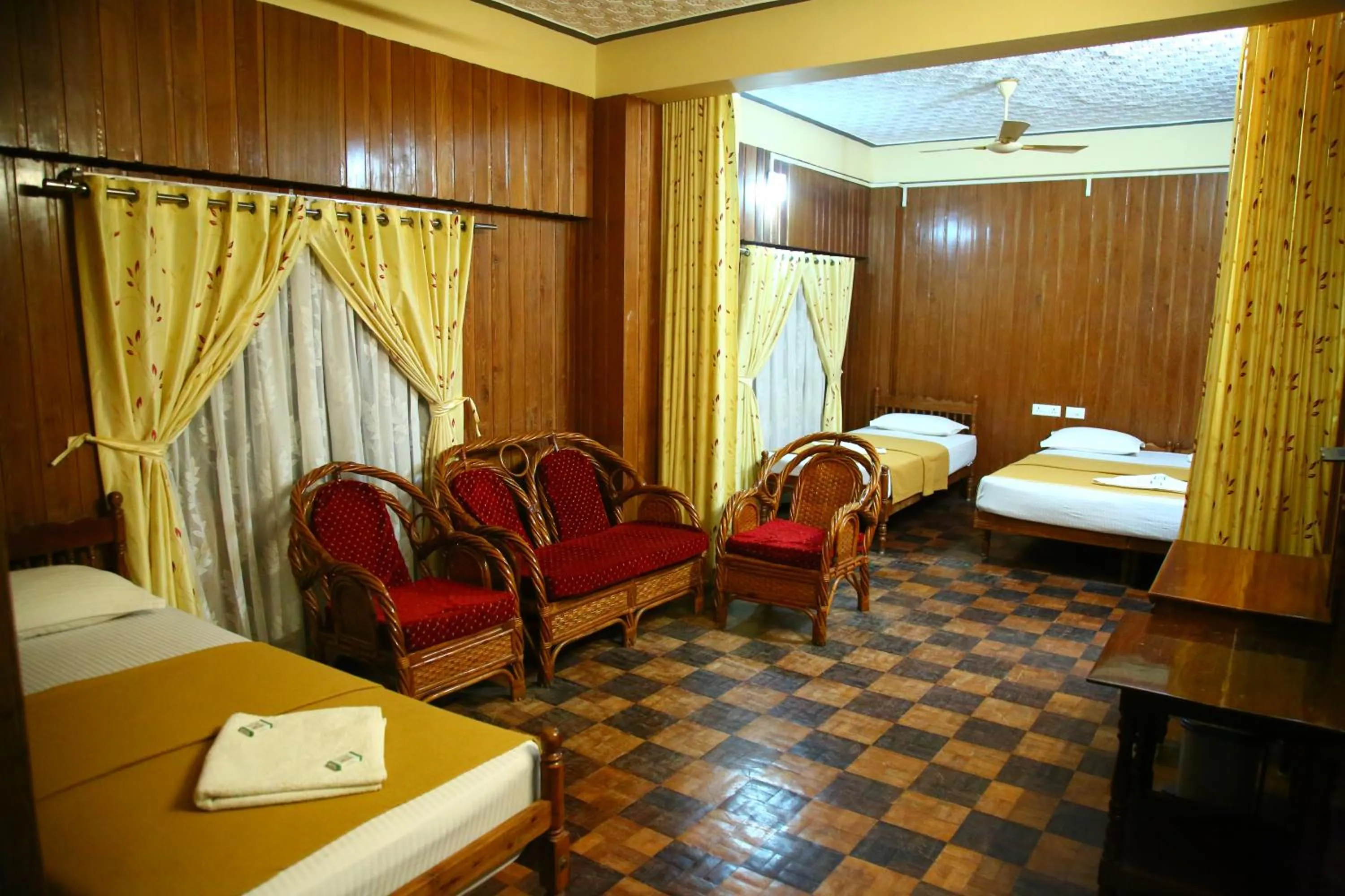 Bed in Lake Palace Family Resort Kumarakom