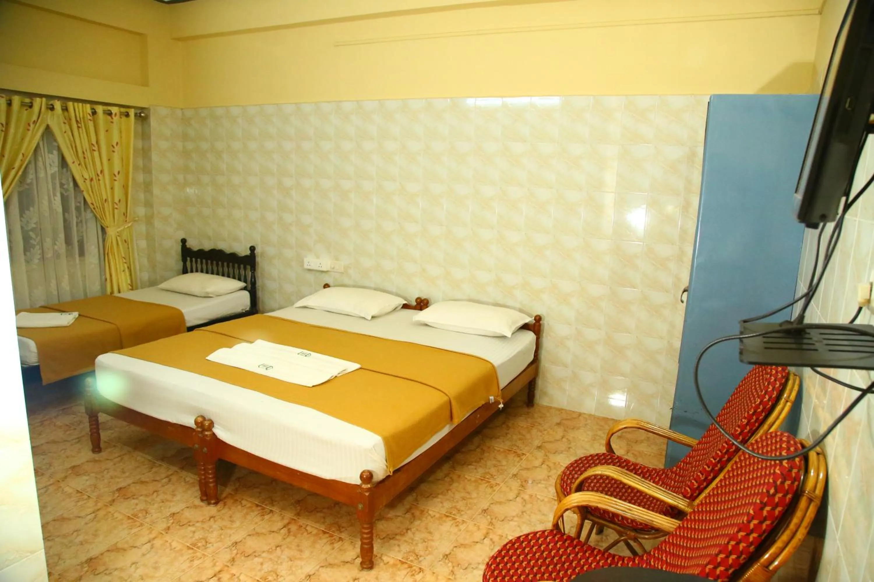 Bed in Lake Palace Family Resort Kumarakom
