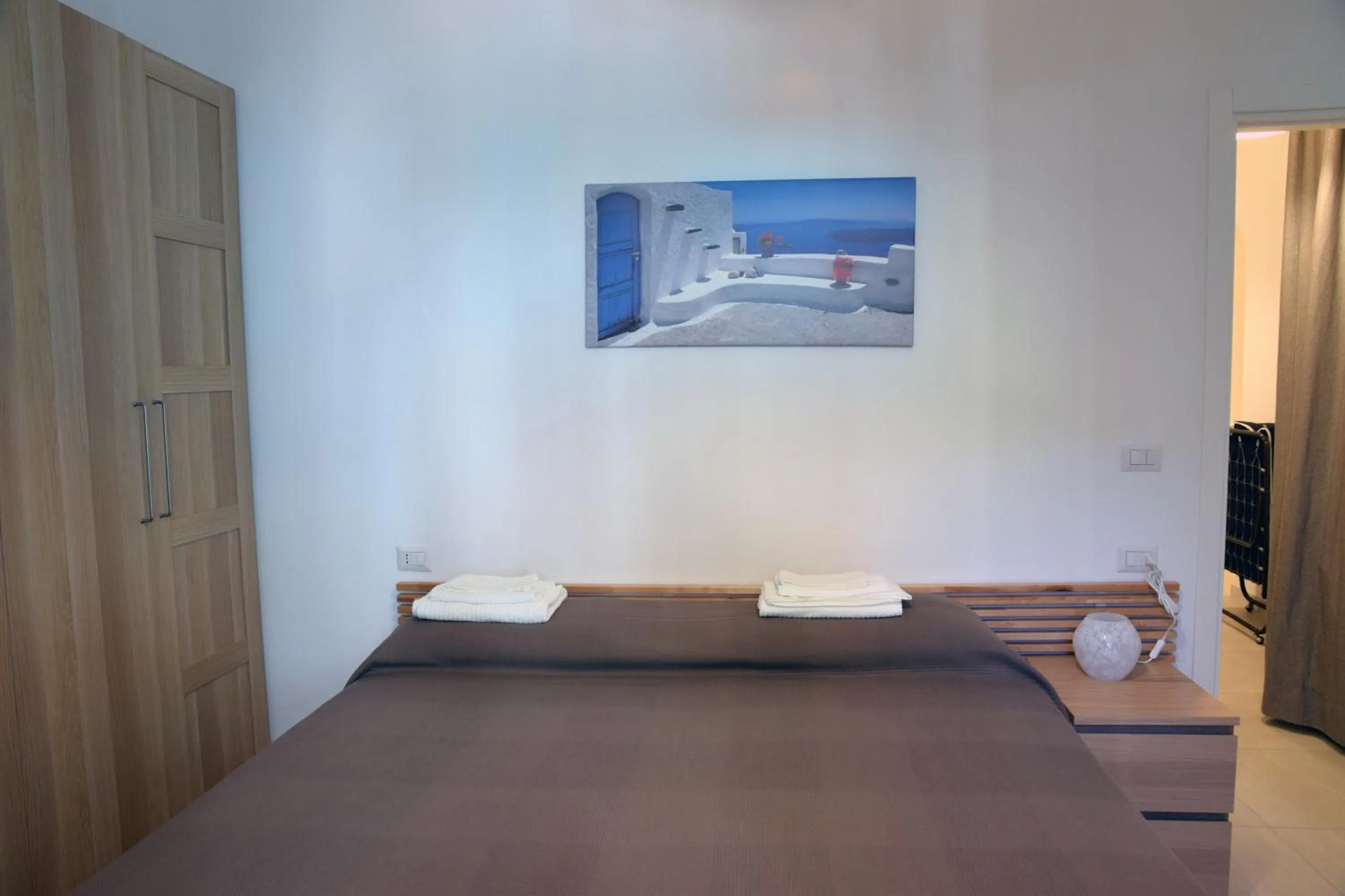 Bed in Sunrise Apartment