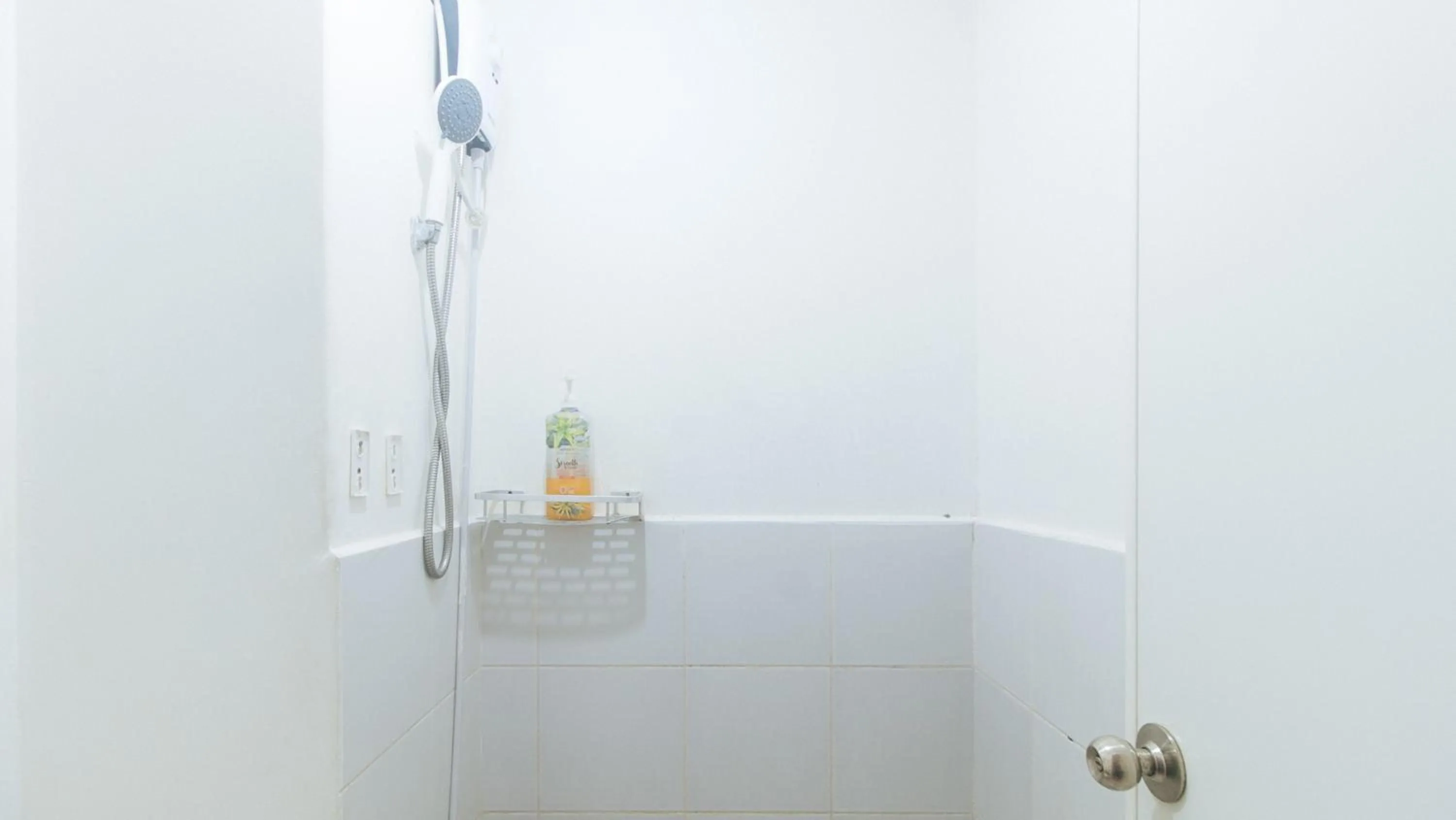 Shower in Eimy's Place at Urban Deca Mandaluyong by RedDoorz