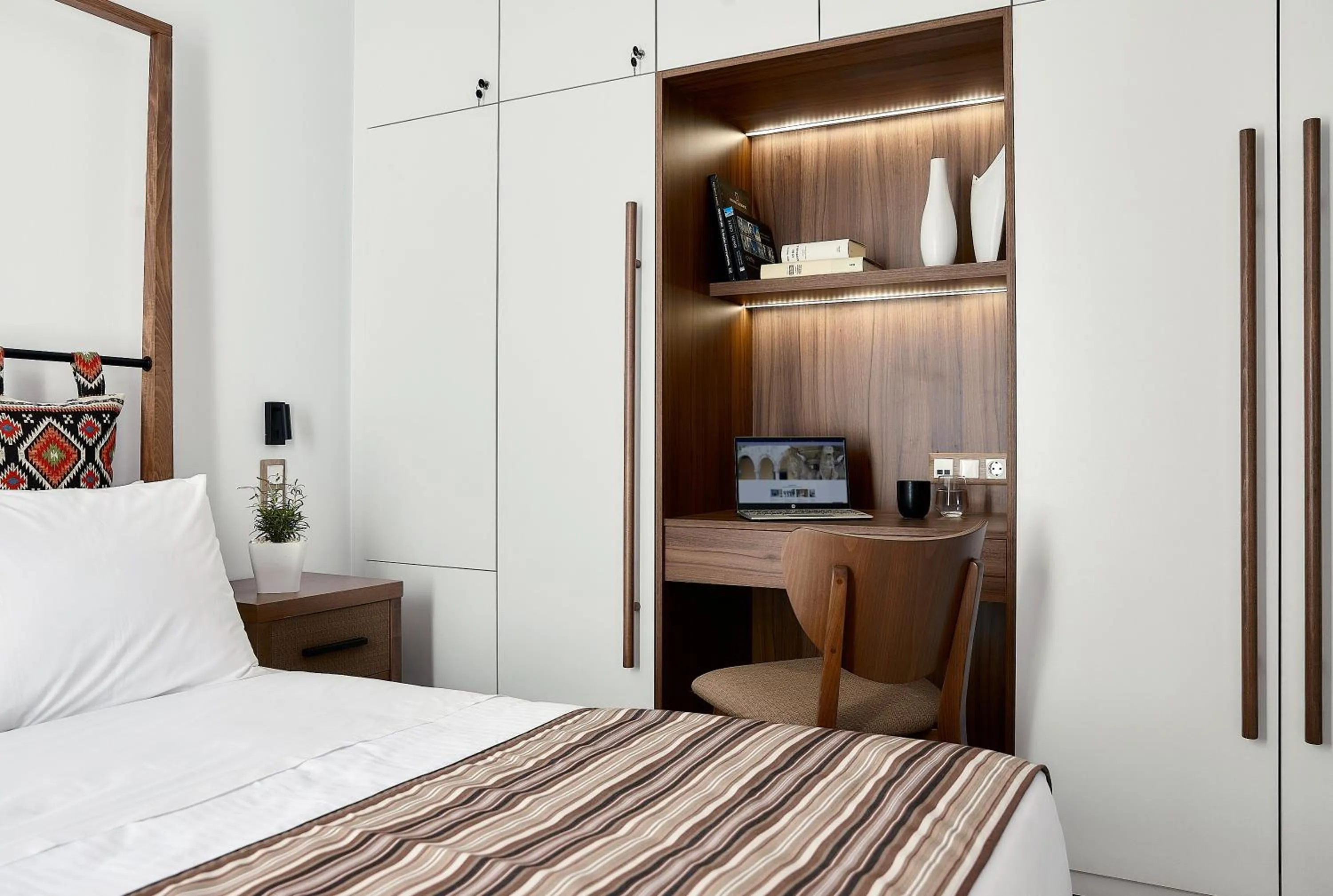 Bed in Volta Suites and Villas