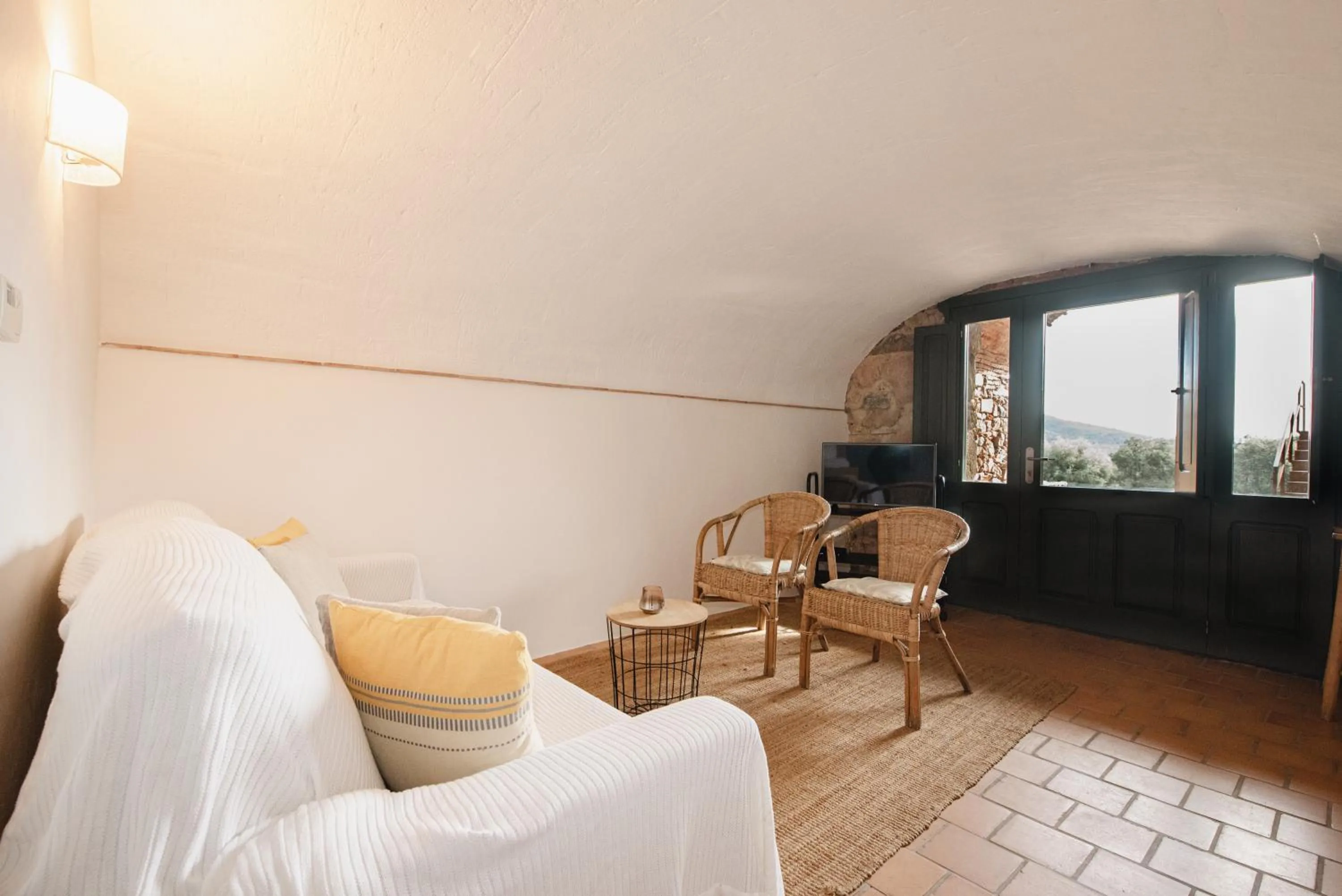 Seating area, Bed in Can Margarit