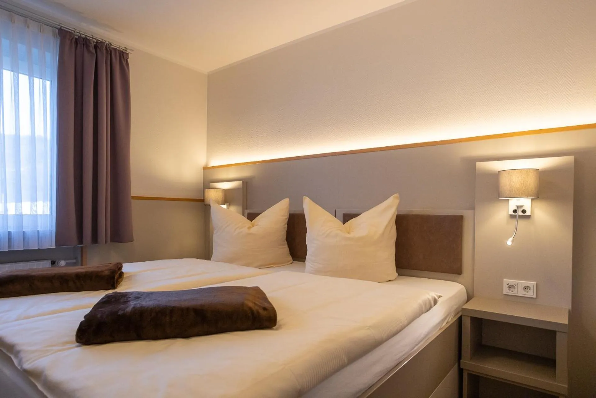 Bed in Stadt-gut-Hotel Siegboot