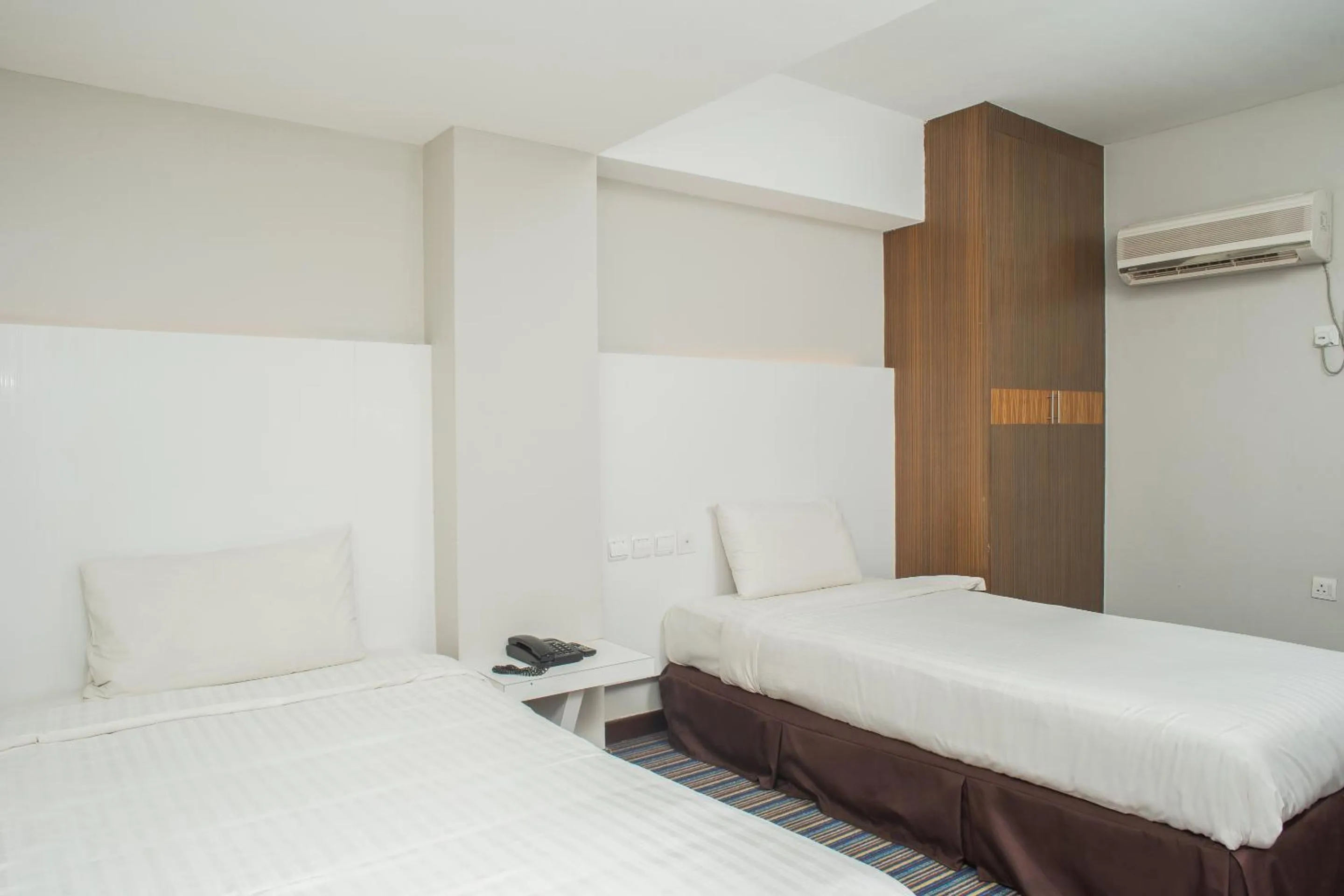 Bedroom in Capital O 90083 Riverfront Inn