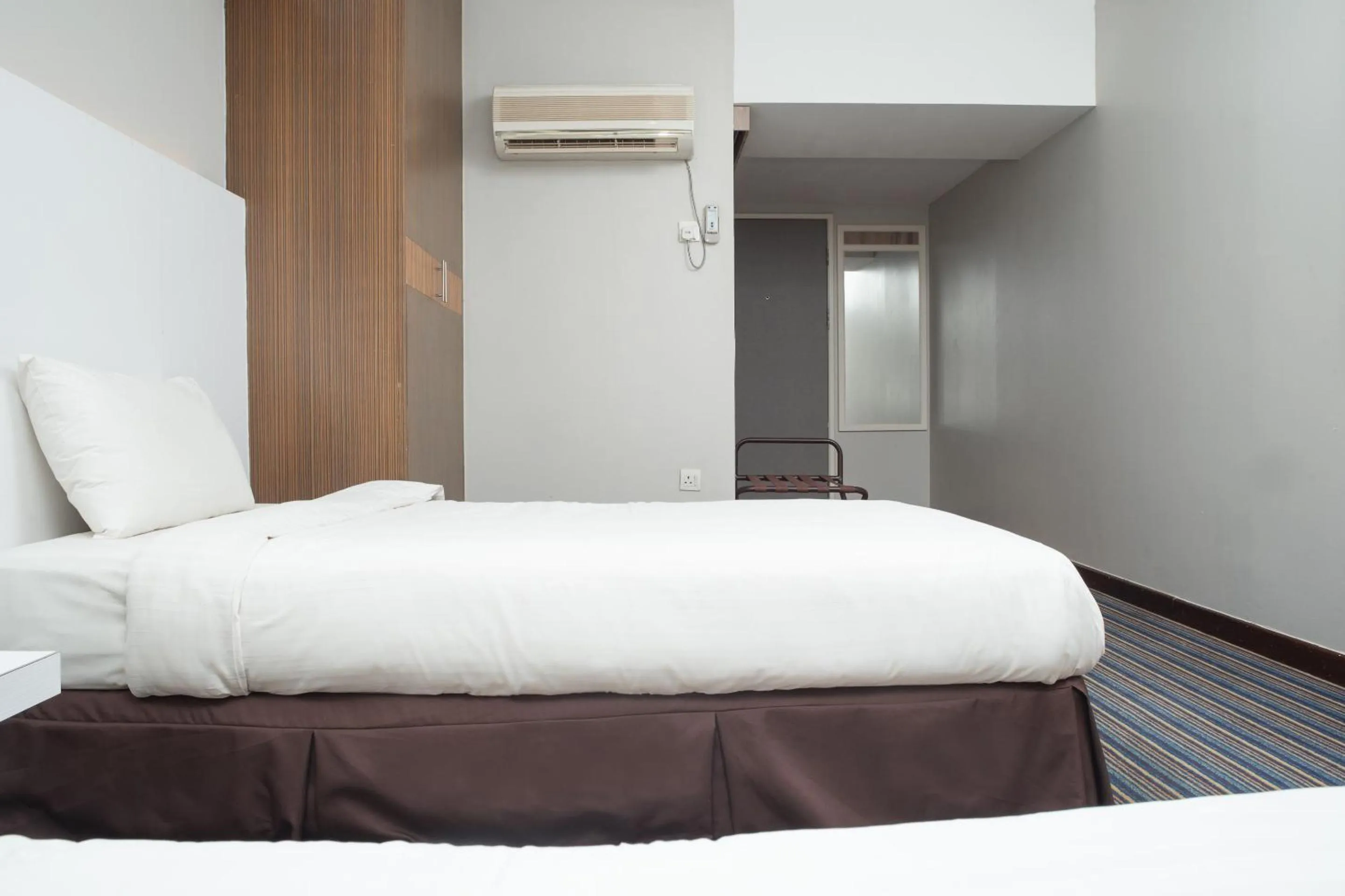 Bedroom in Capital O 90083 Riverfront Inn