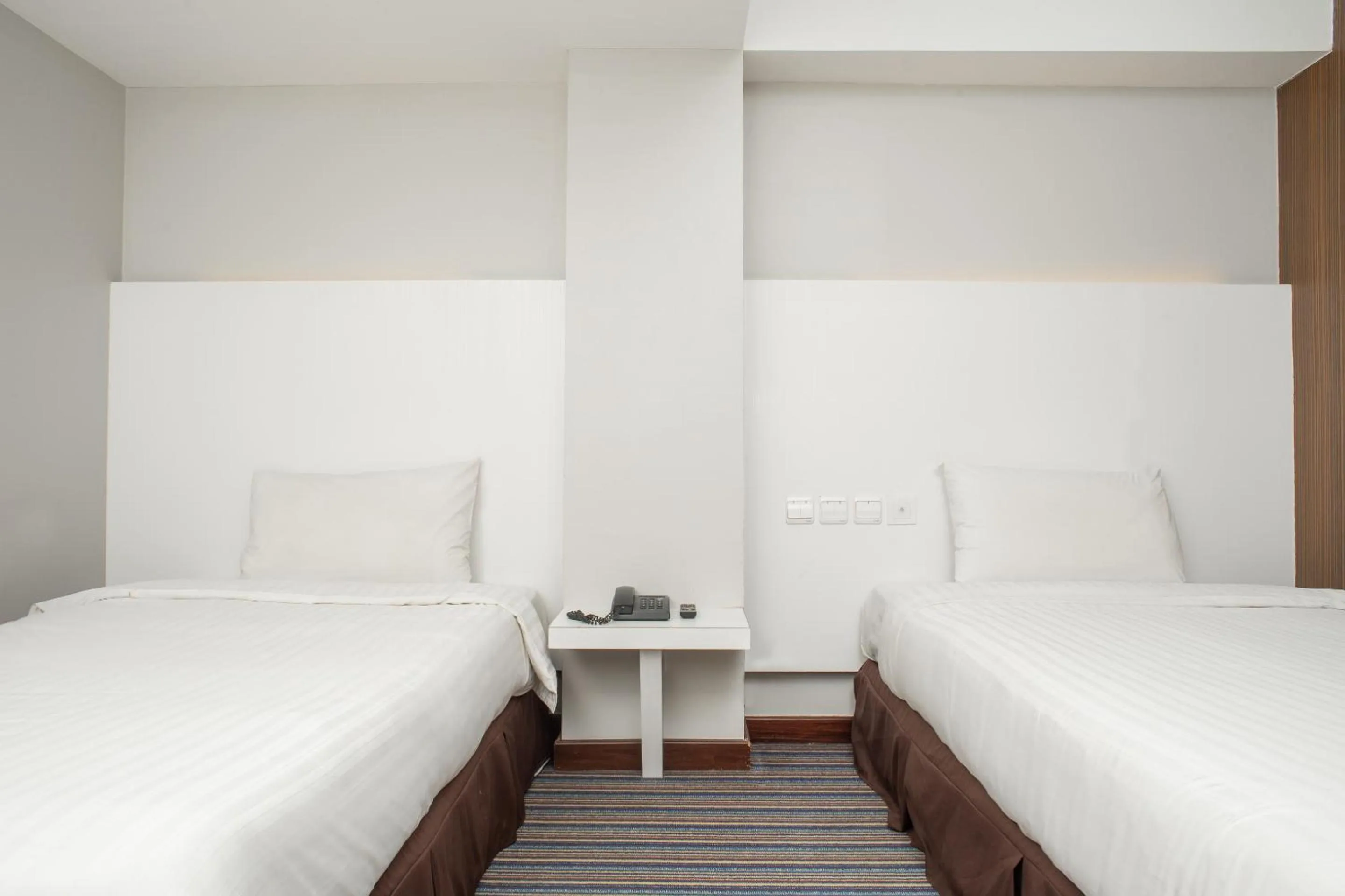 Bedroom in Capital O 90083 Riverfront Inn